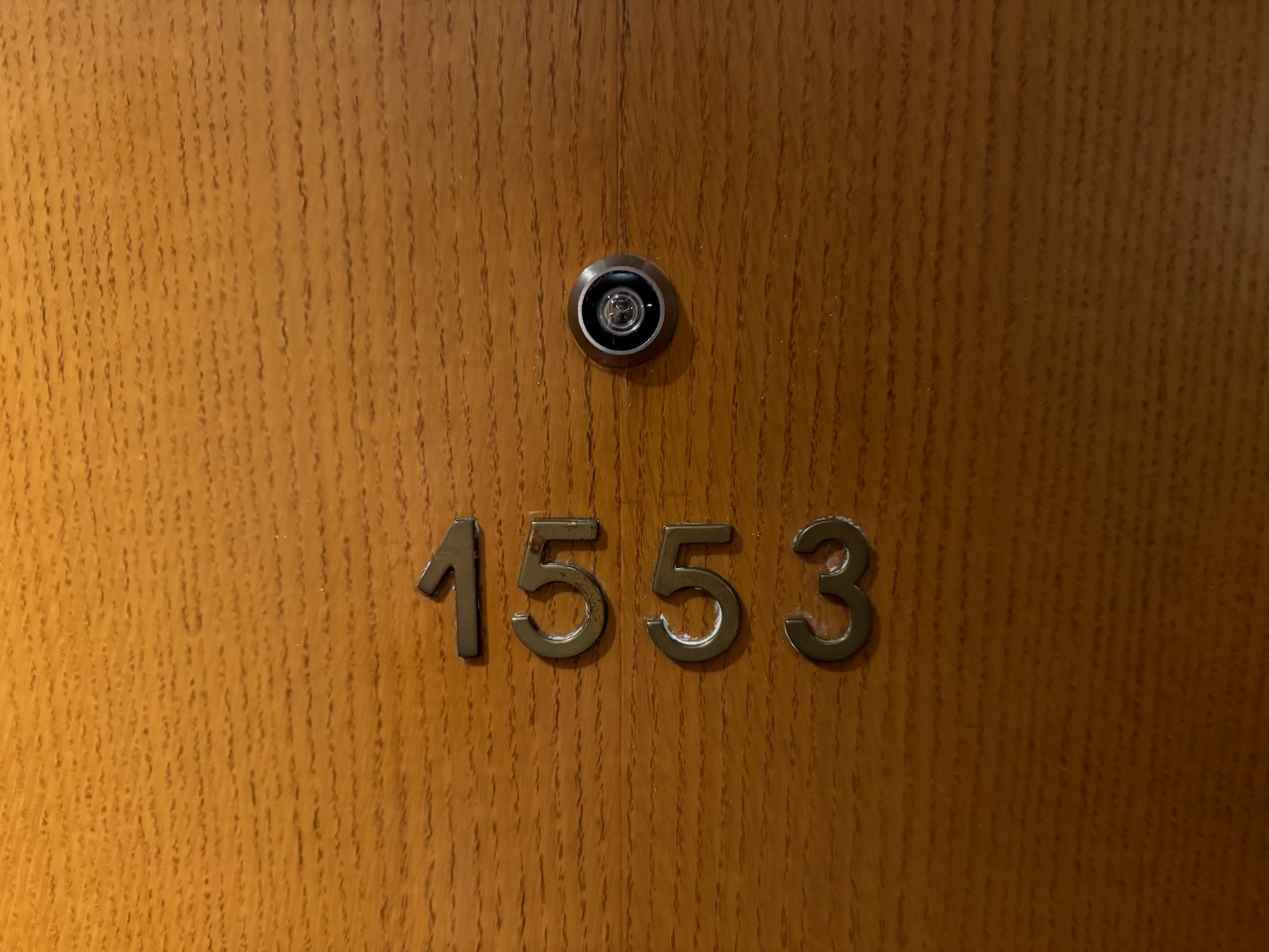 a door with numbers and a hole in the middle