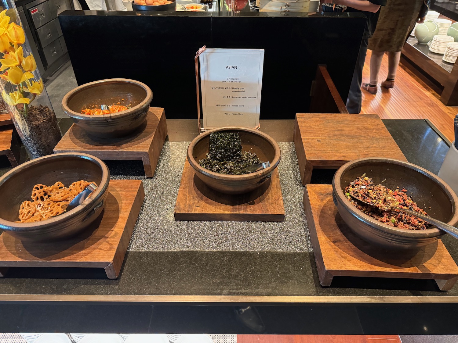 a group of bowls of food on a counter