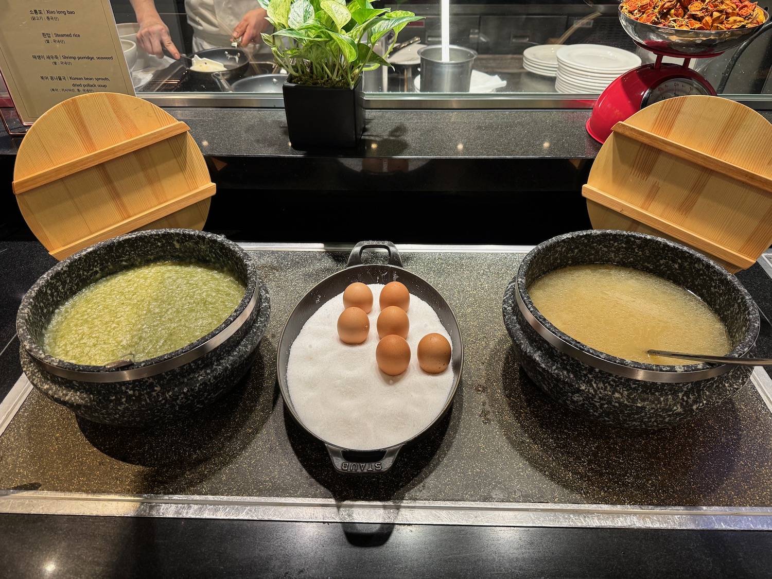 a group of bowls of food on a counter