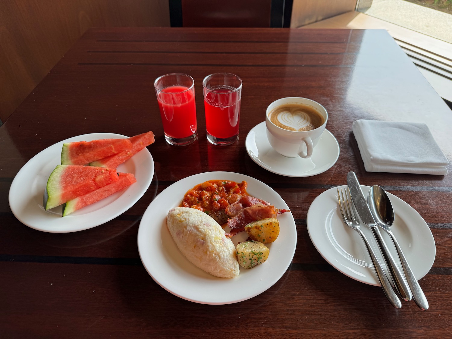 a plate of food and drinks on a table