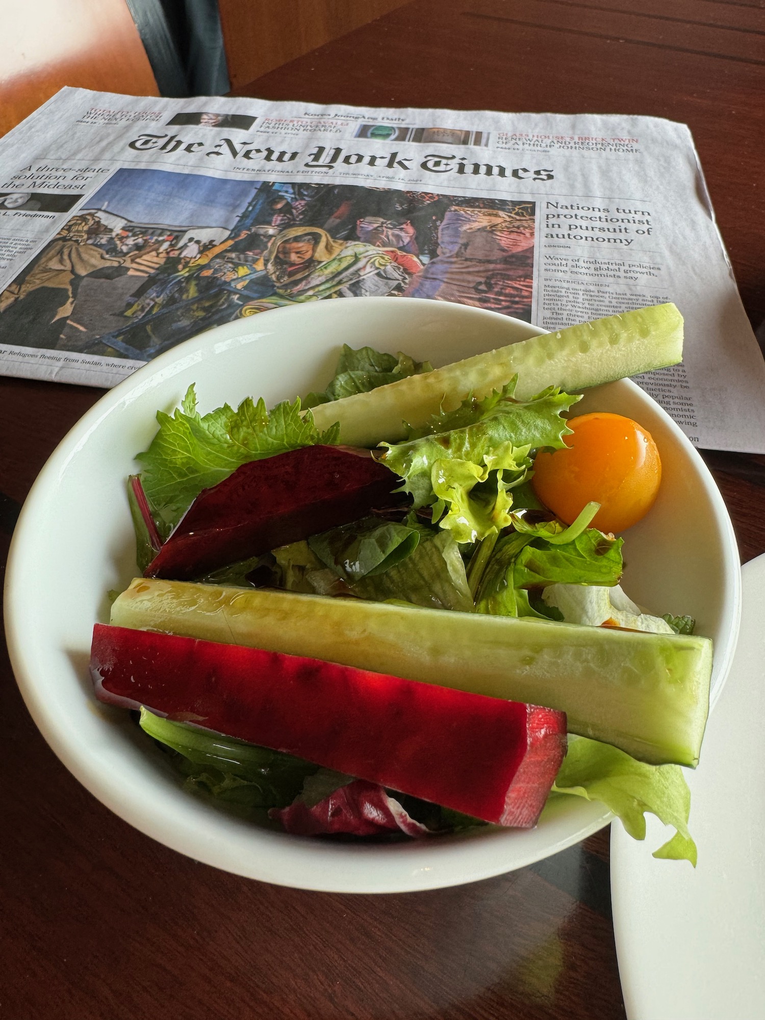 a bowl of salad with vegetables in it