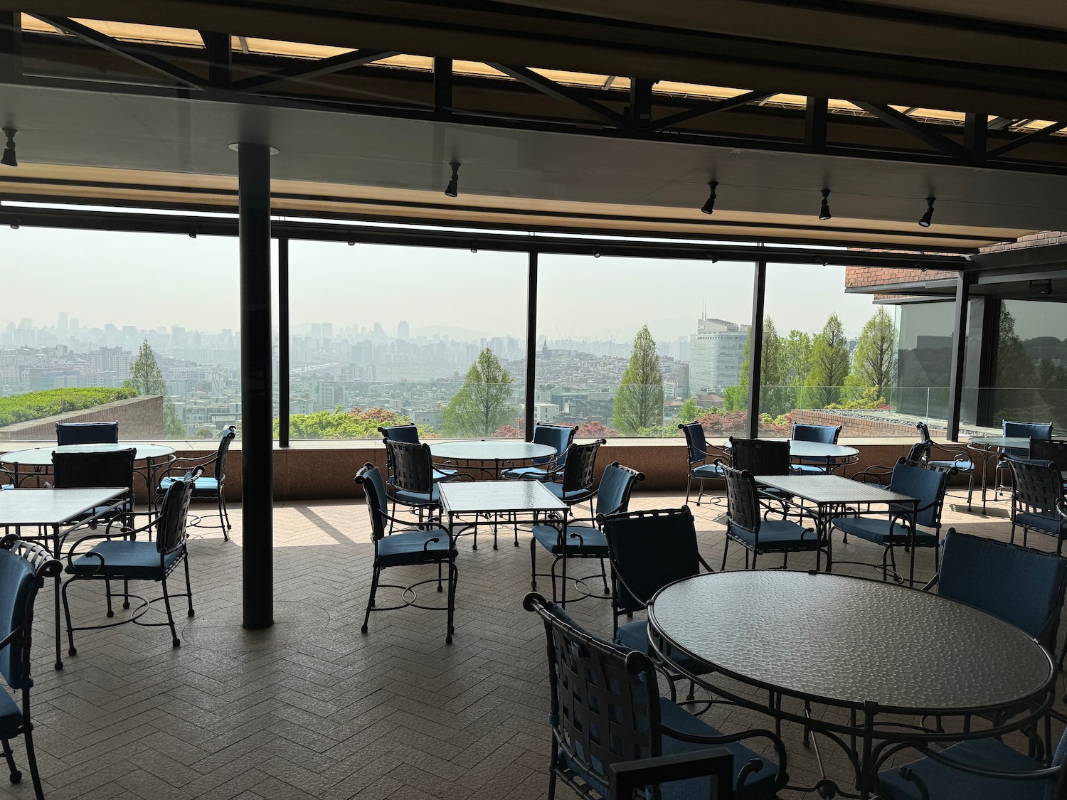 a patio with tables and chairs