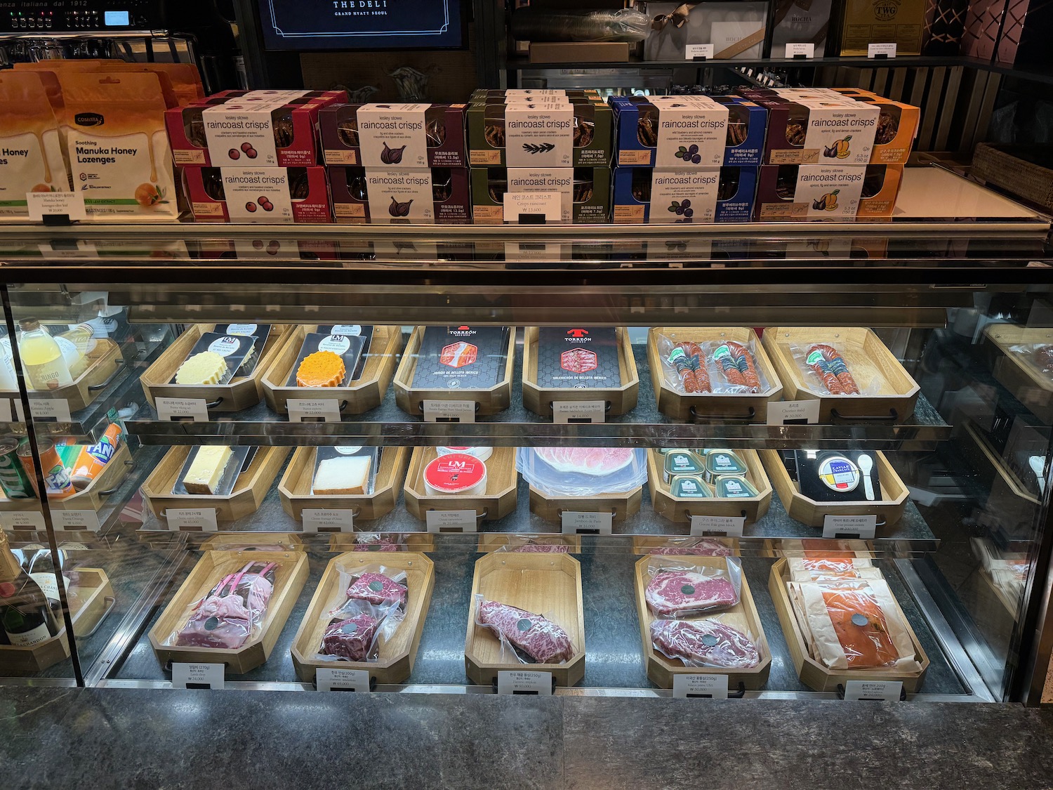 a display case with different types of meat in it