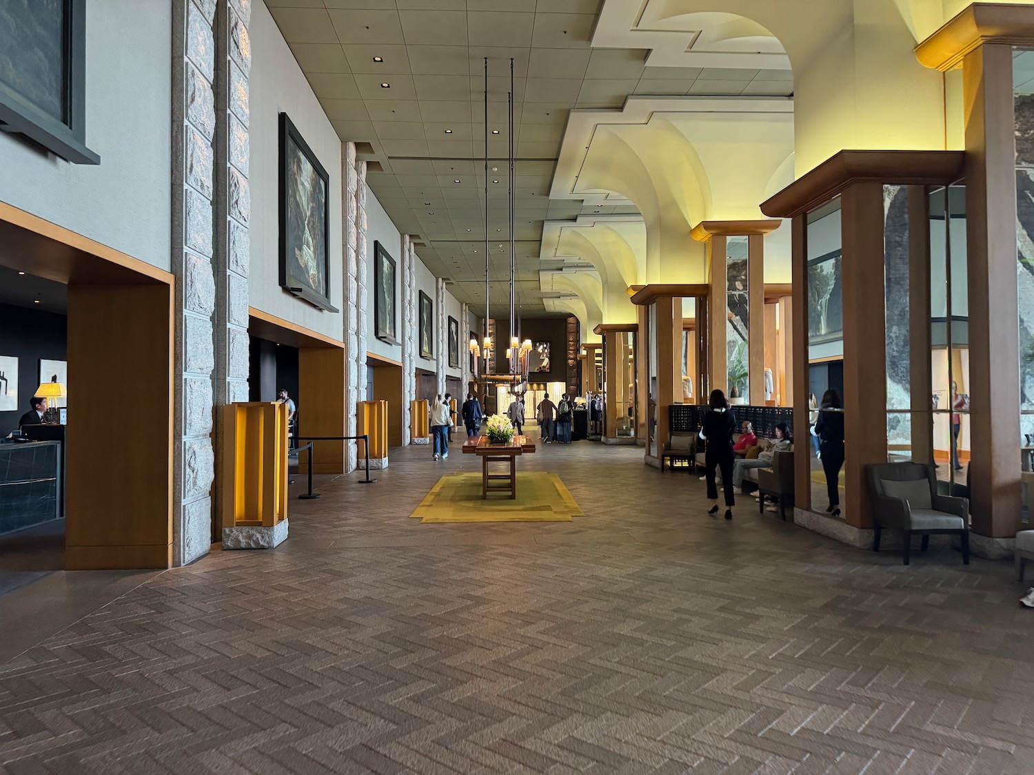 a large building with columns and people walking