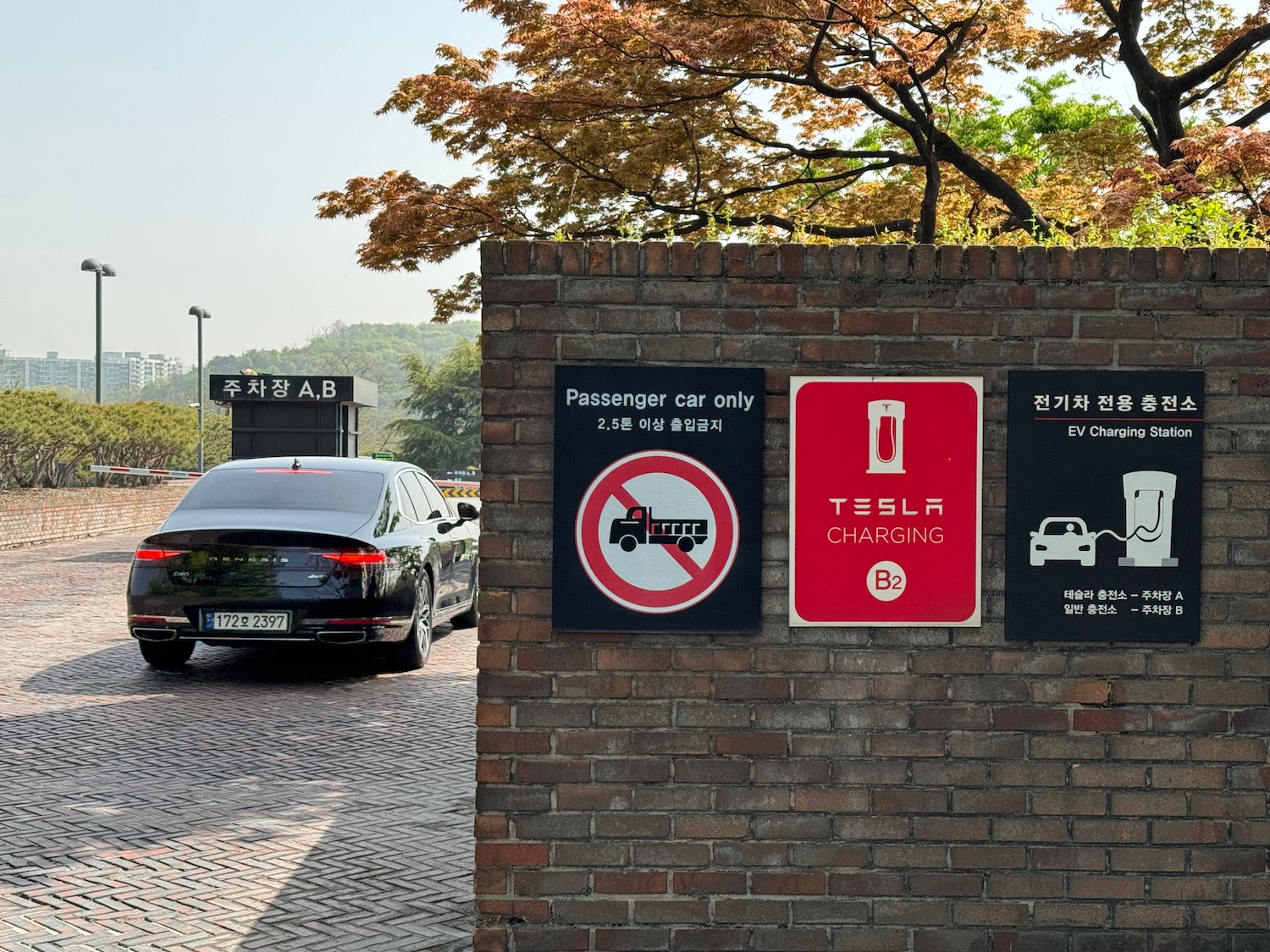 a car parked on a brick wall