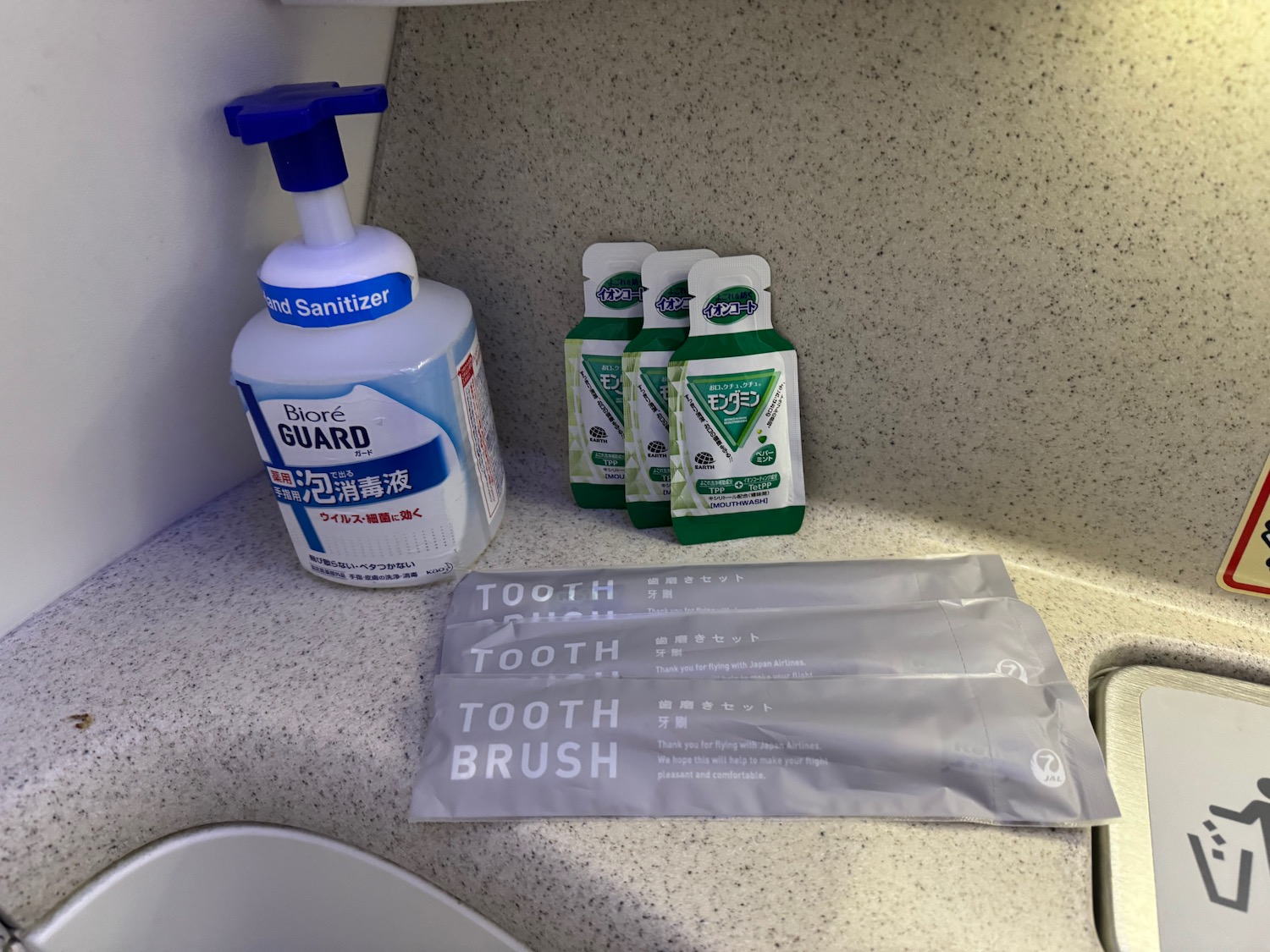 a group of toothpaste and toothbrushes on a counter