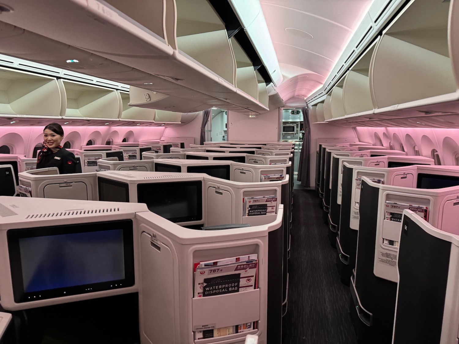 an airplane with rows of tvs and shelves