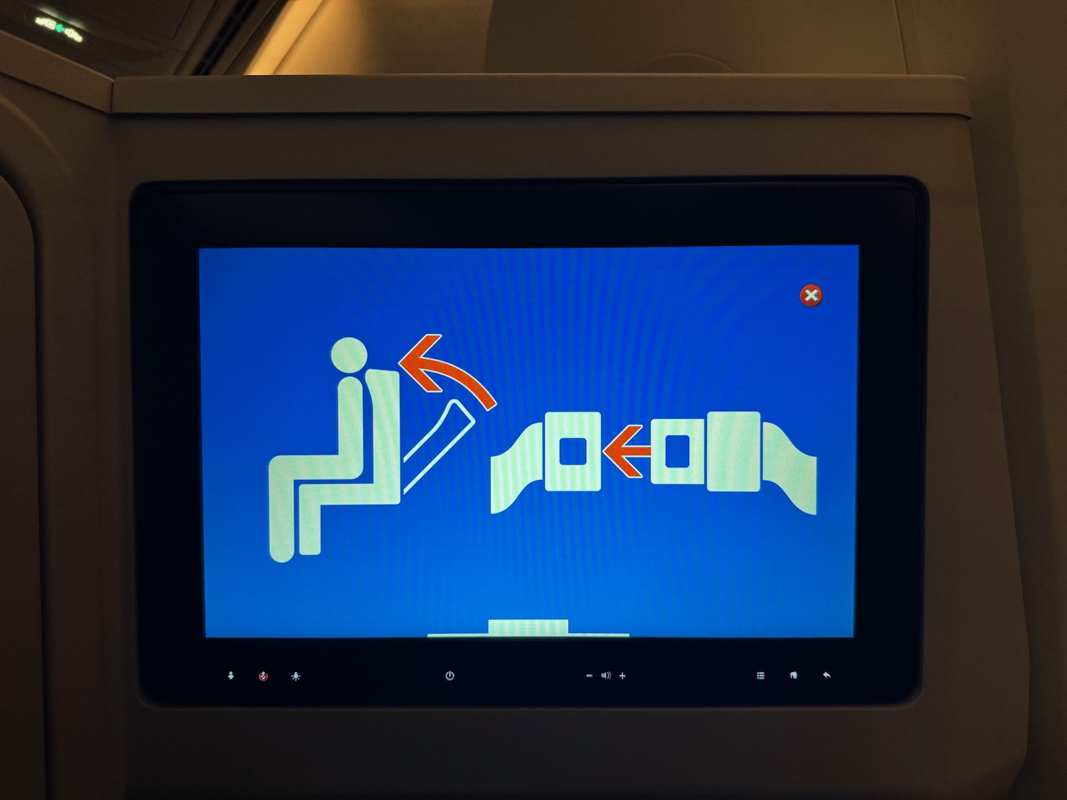 a screen with a blue screen and a blue arrow pointing to a person sitting