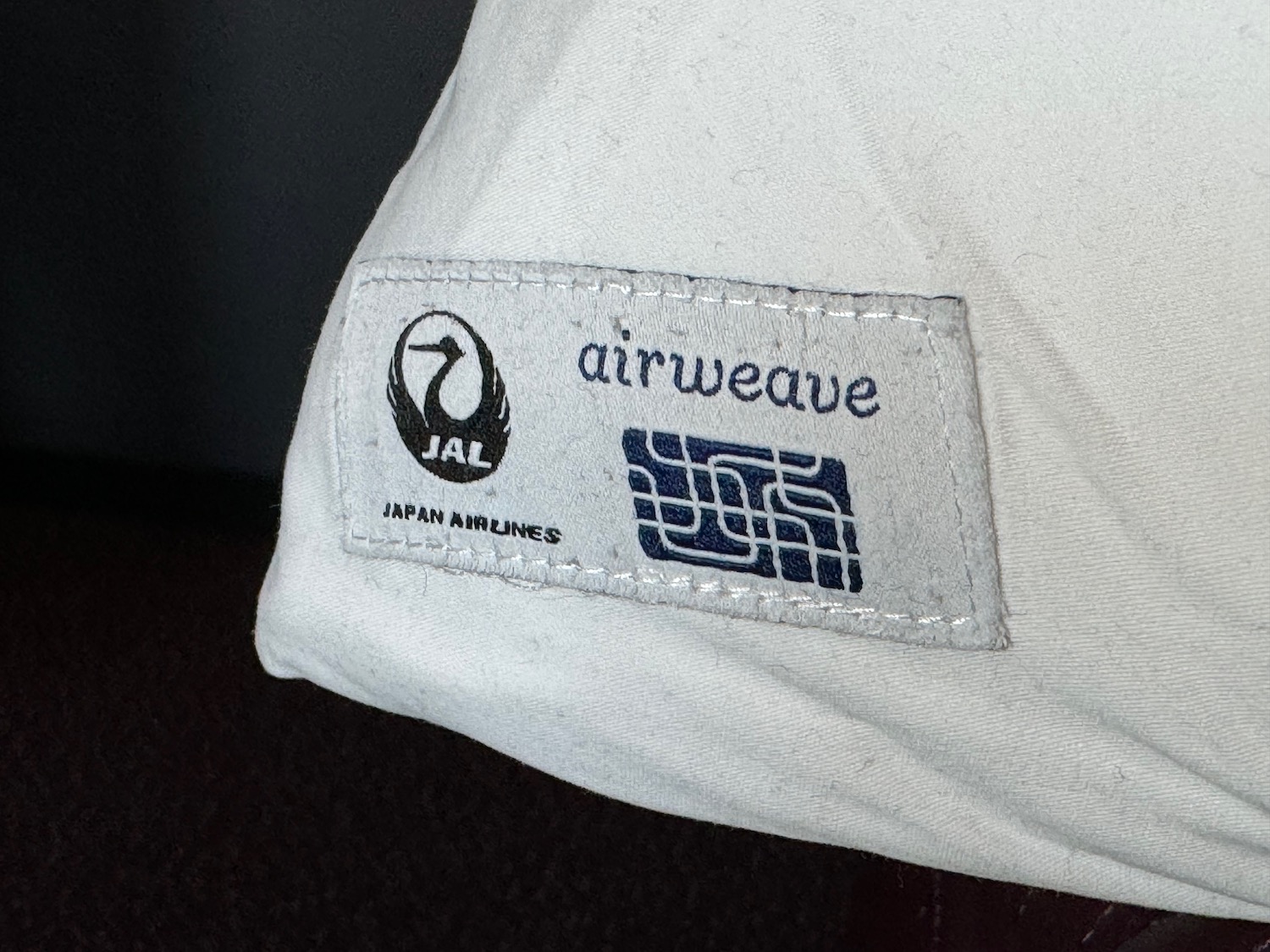 a white shirt with a logo on it