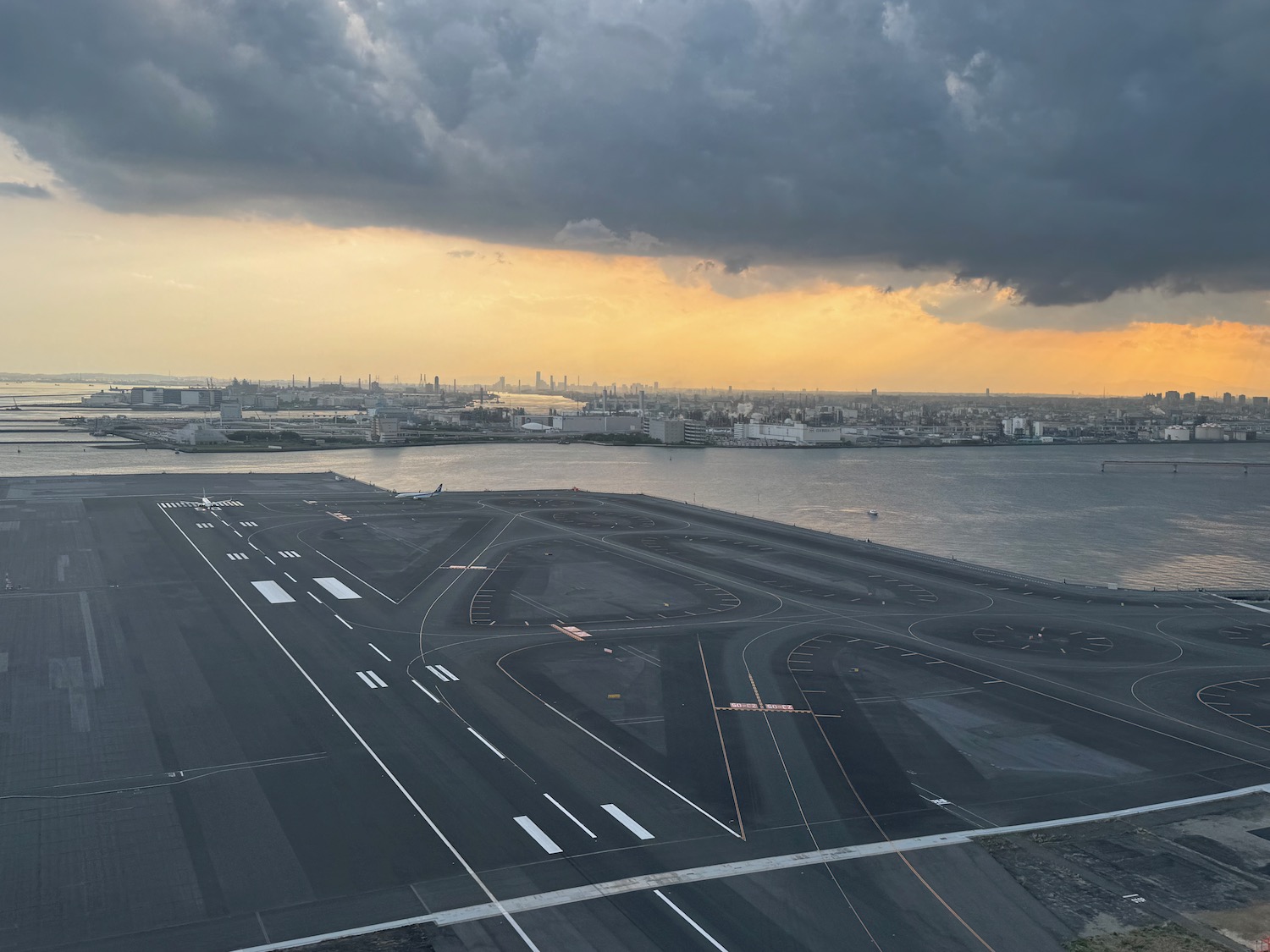 a runway with a city in the background