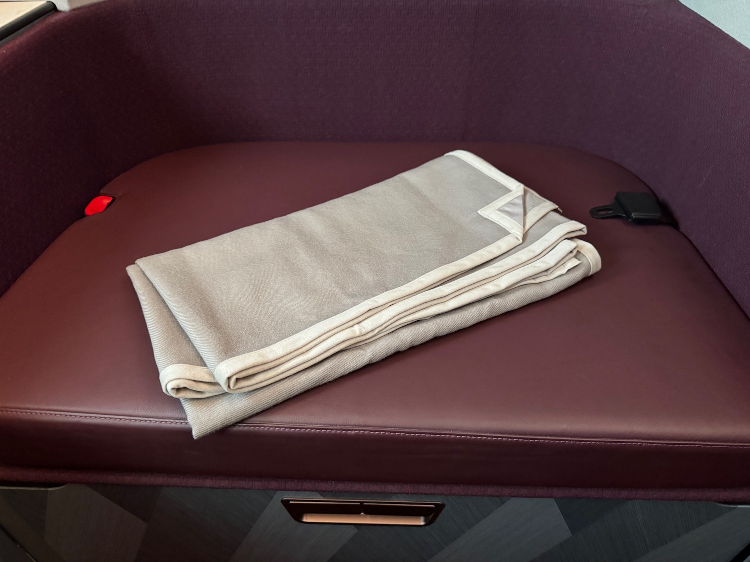 a folded blanket on a couch