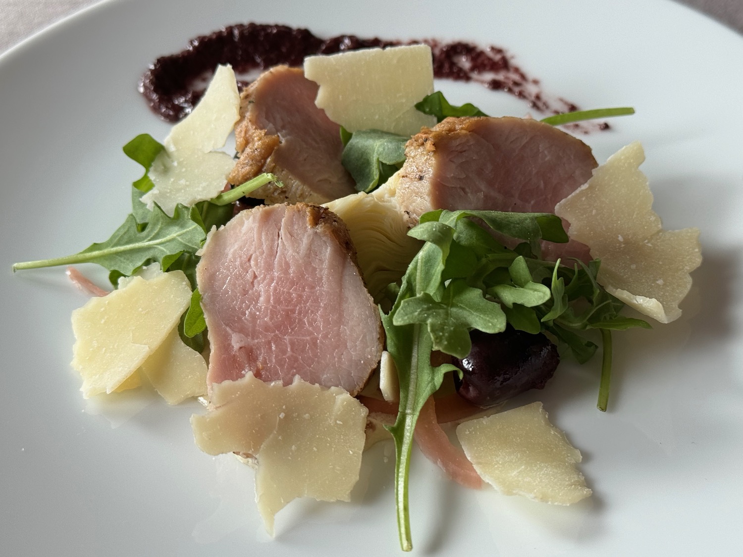 a plate of food on a white surface