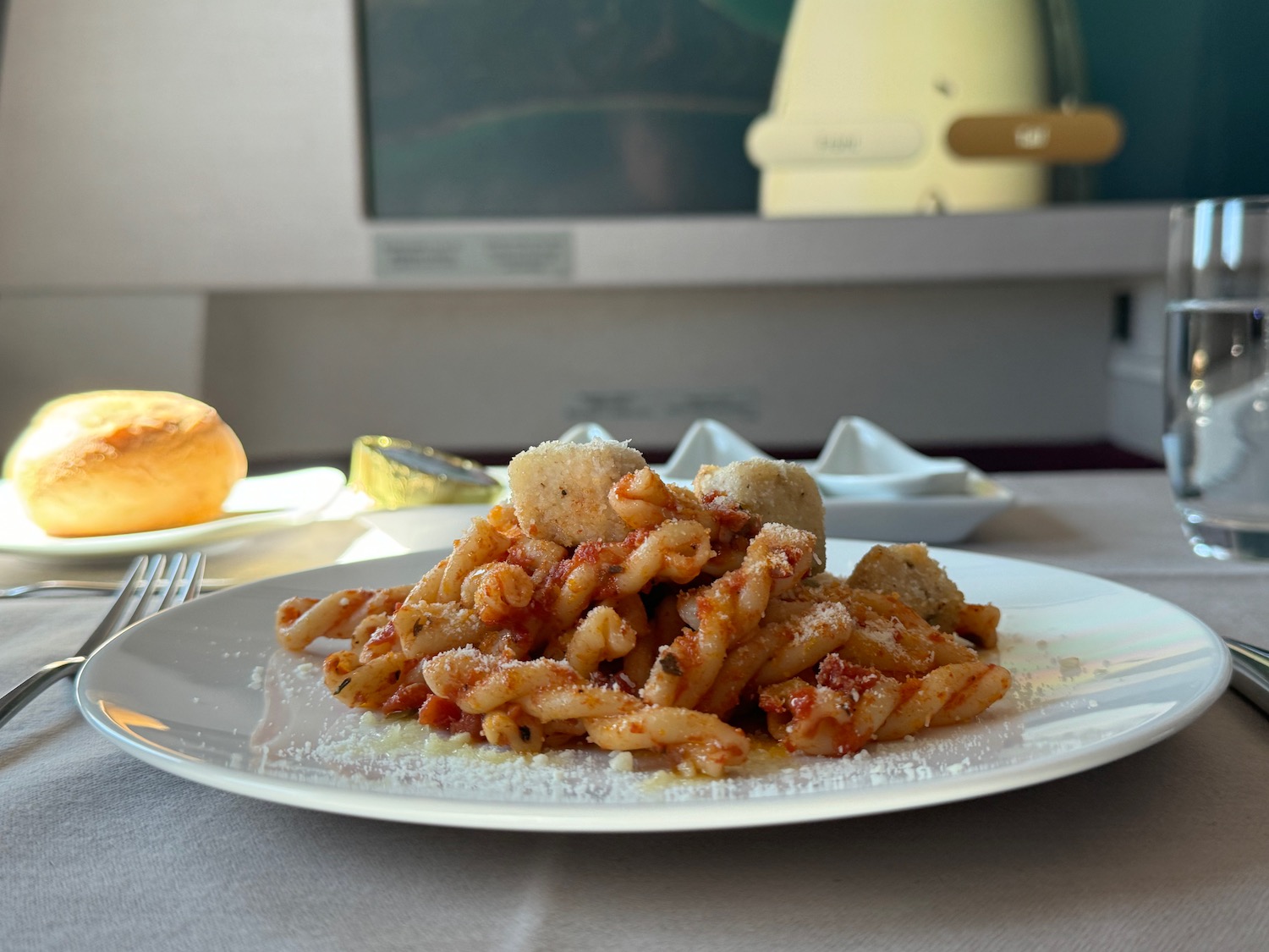 a plate of pasta with sauce and cheese on it