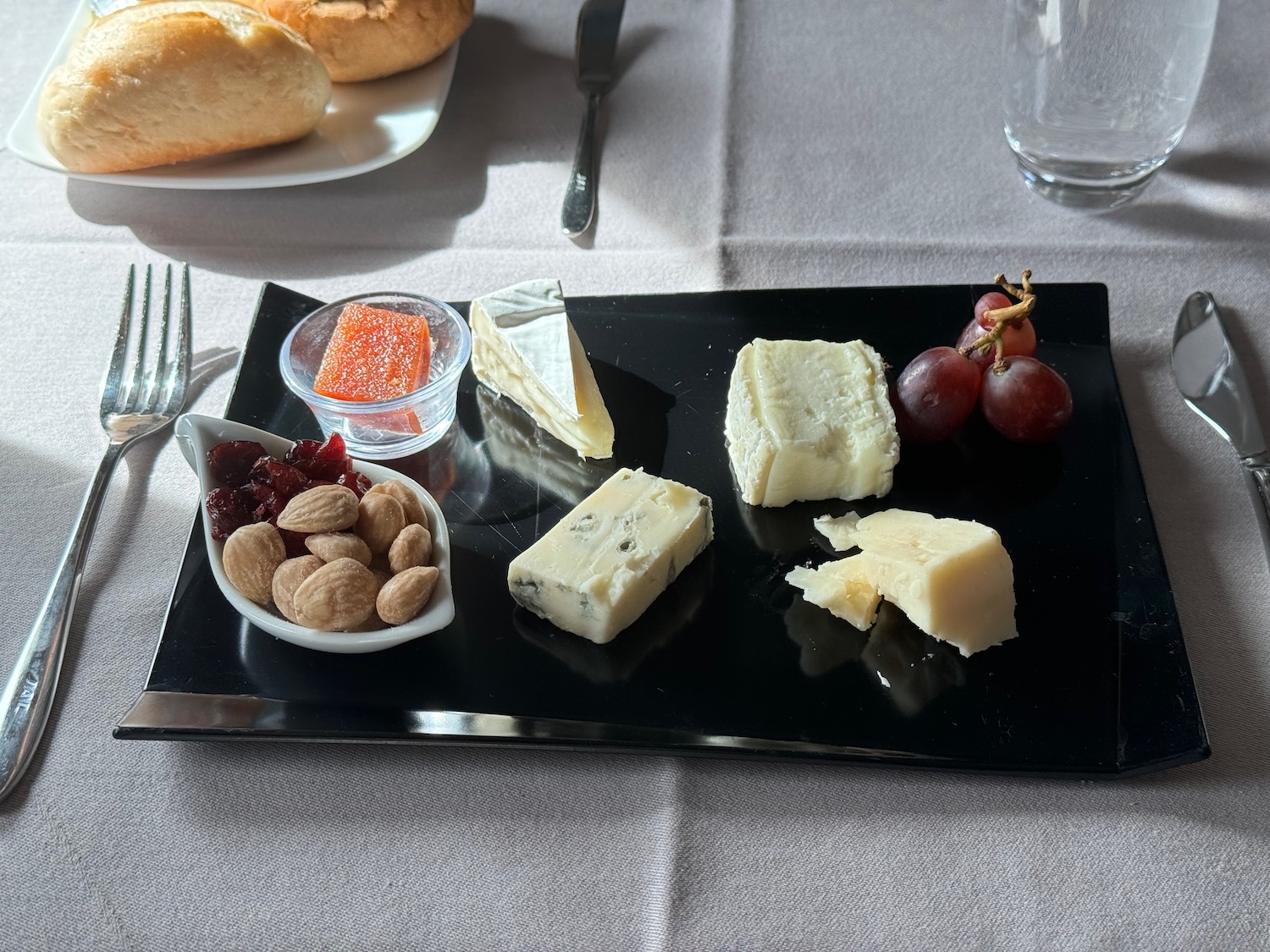 a plate of cheese and nuts