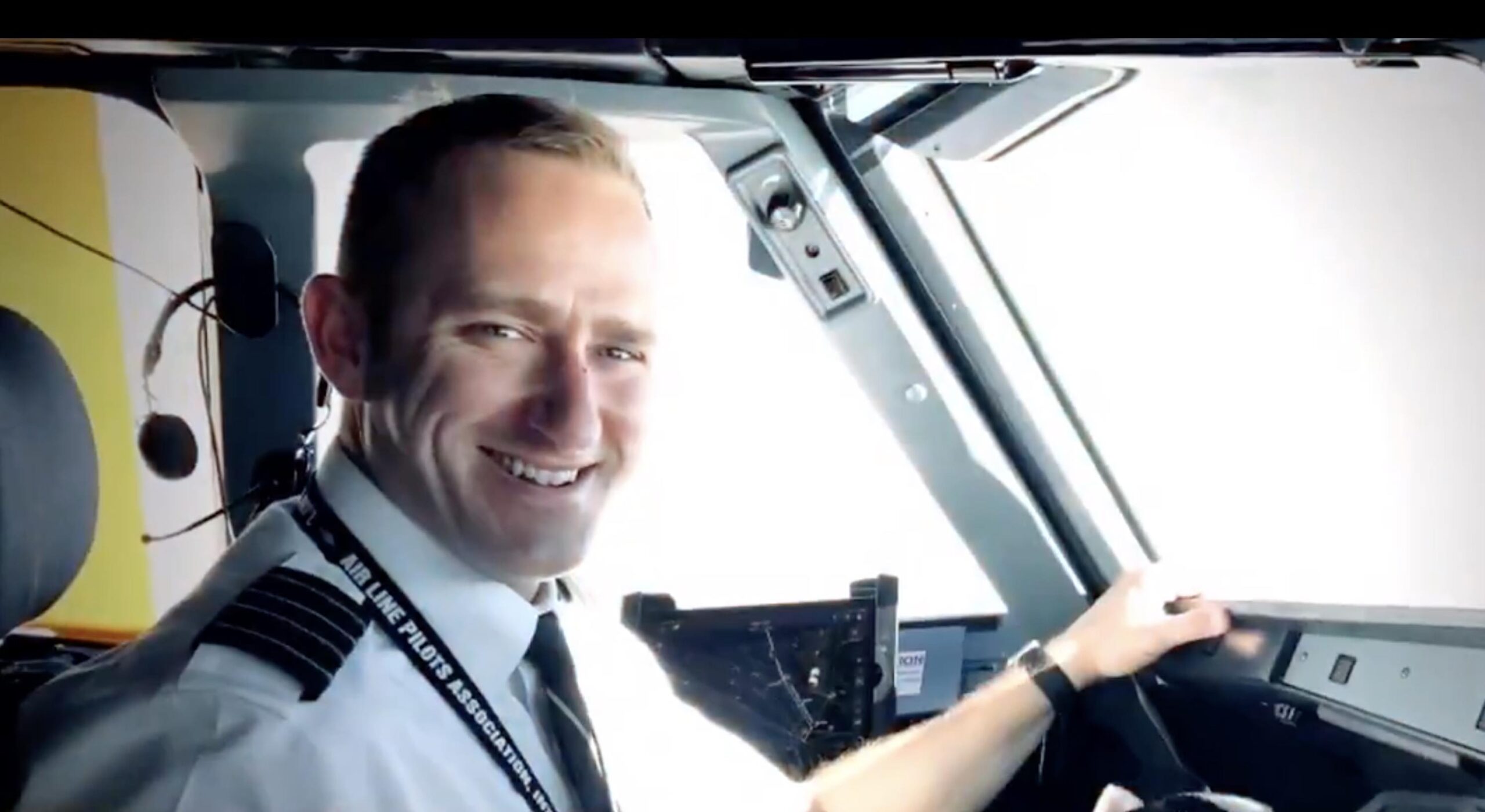 a man in a tie smiling