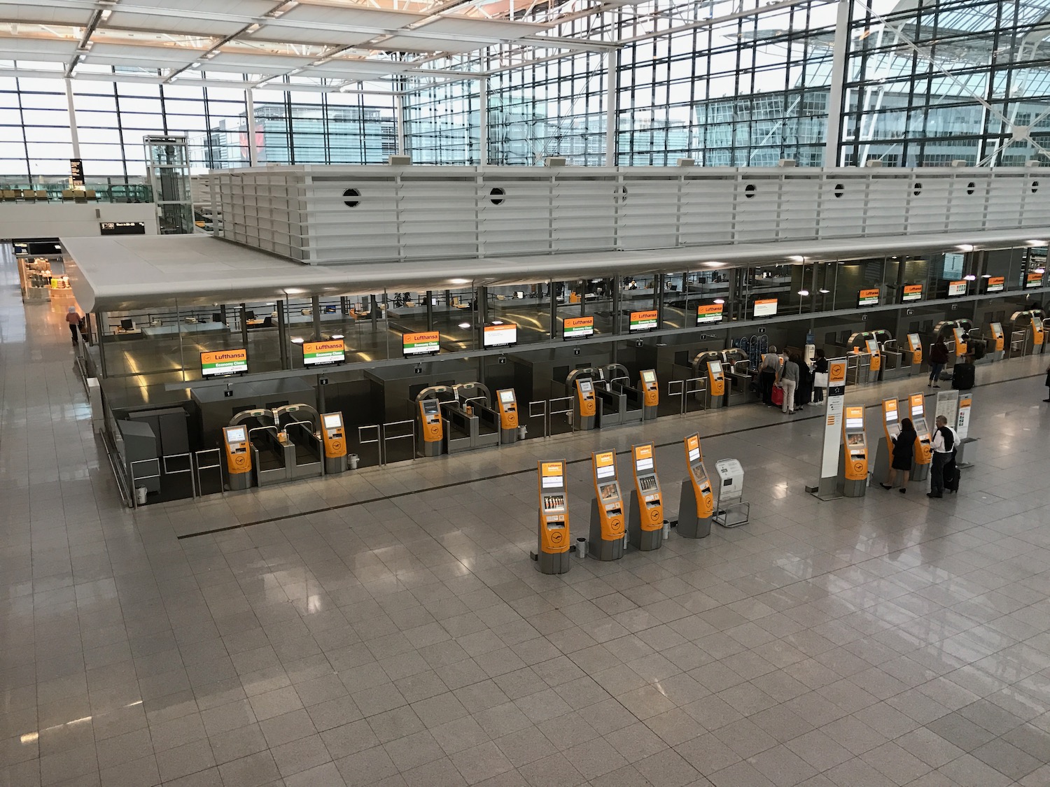 an airport terminal with a check-in area