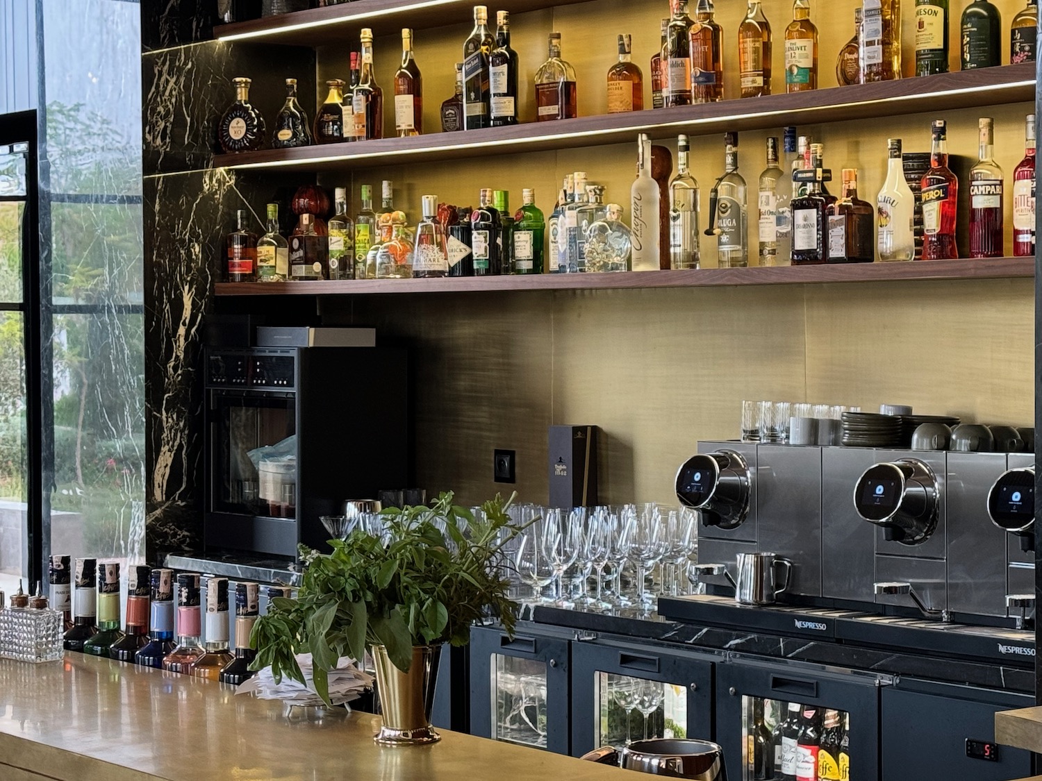 a bar with bottles and glasses