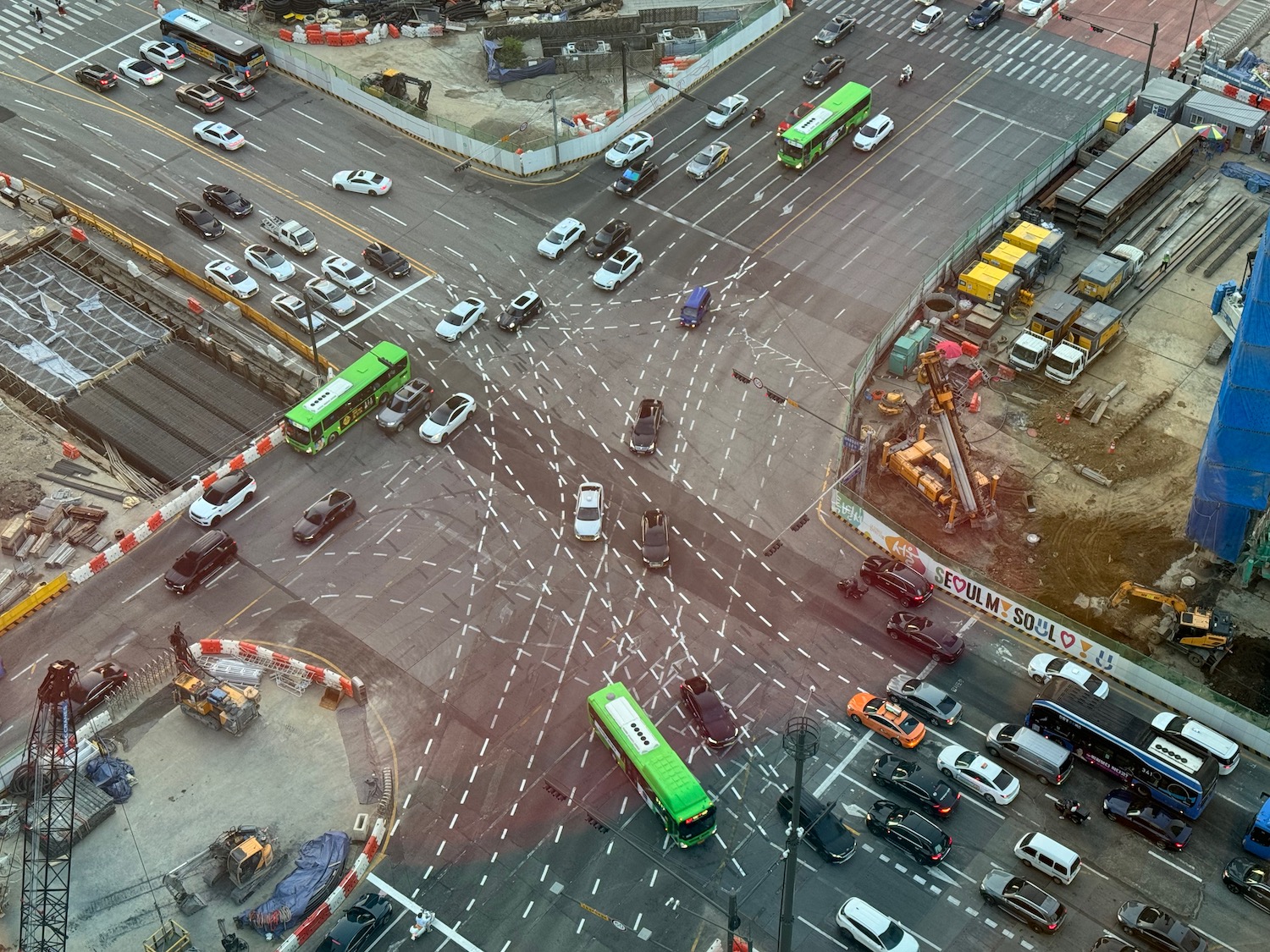 a traffic intersection with buses and buses