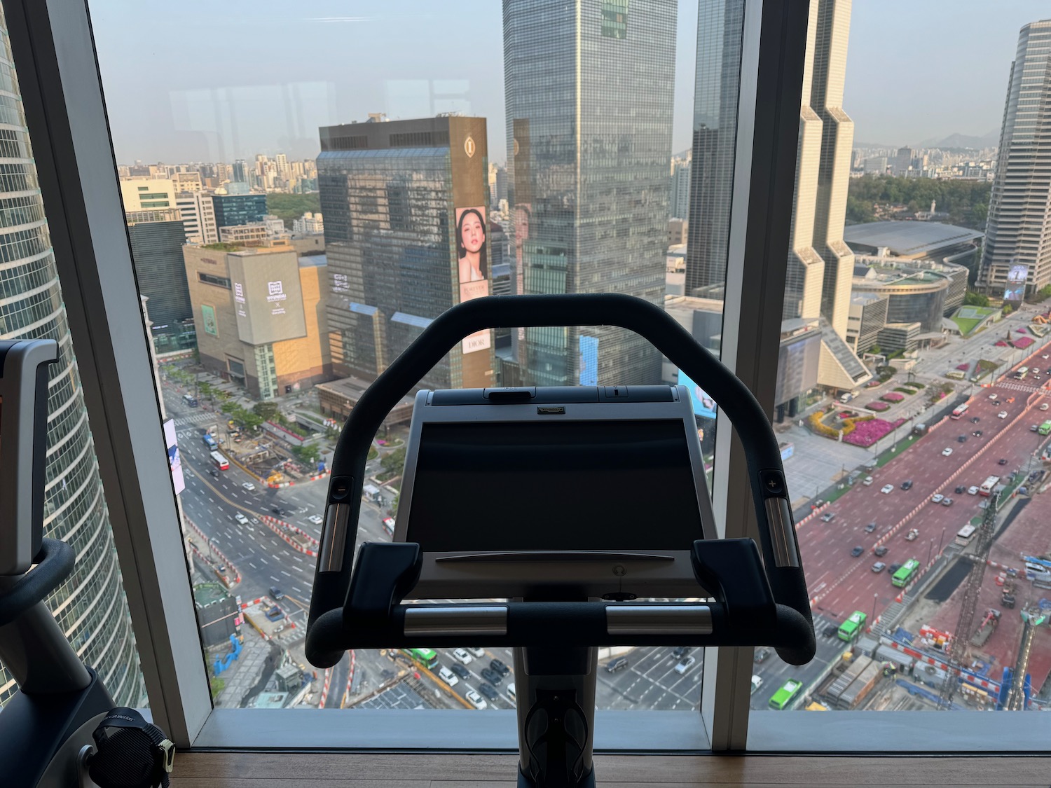 a exercise bike in a room with a view of a city