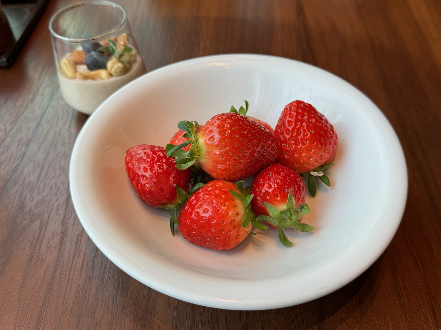 a bowl of strawberries on a table