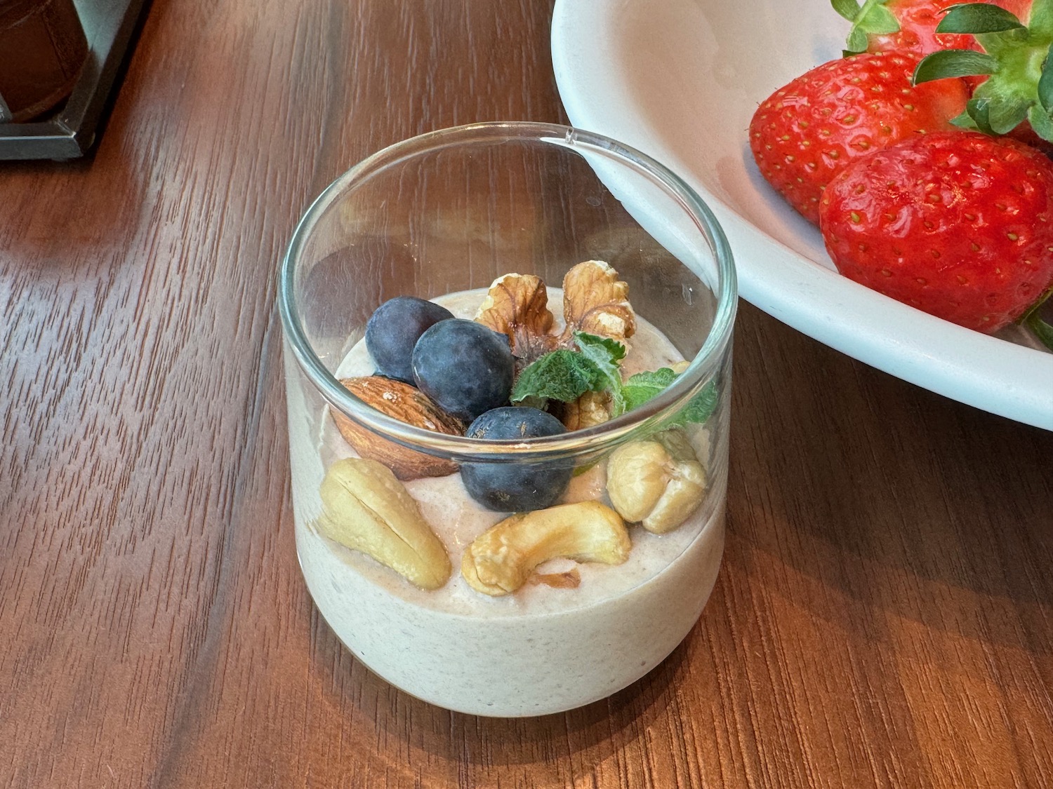 a glass of fruit and nuts