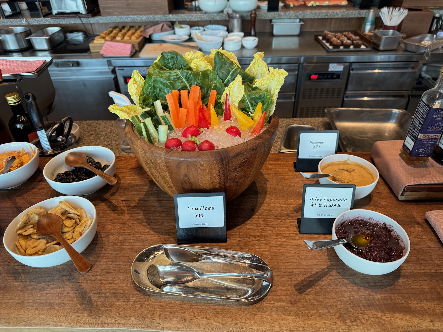 a bowl of vegetables and other food on a table