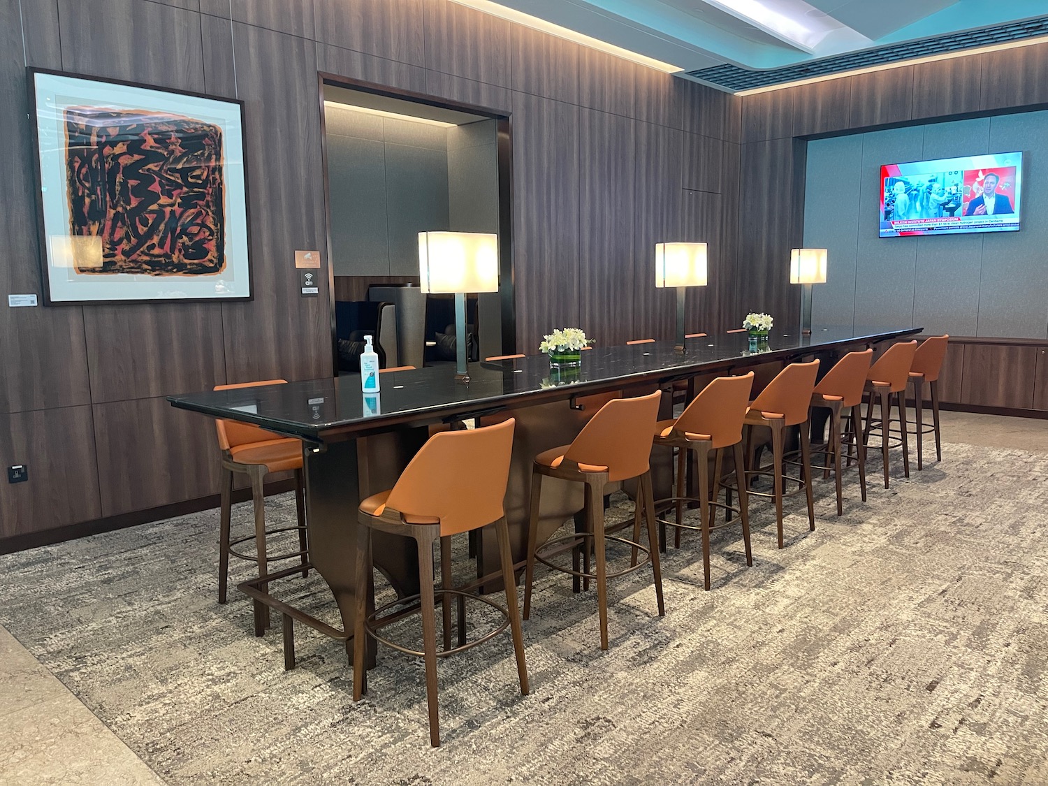 a long table with chairs in a room