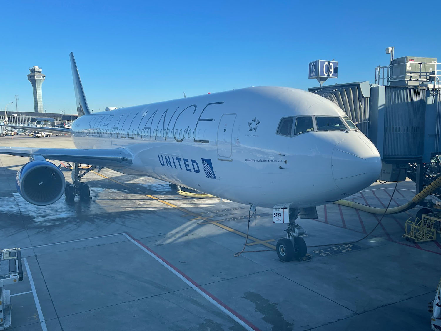 a white airplane at an airport