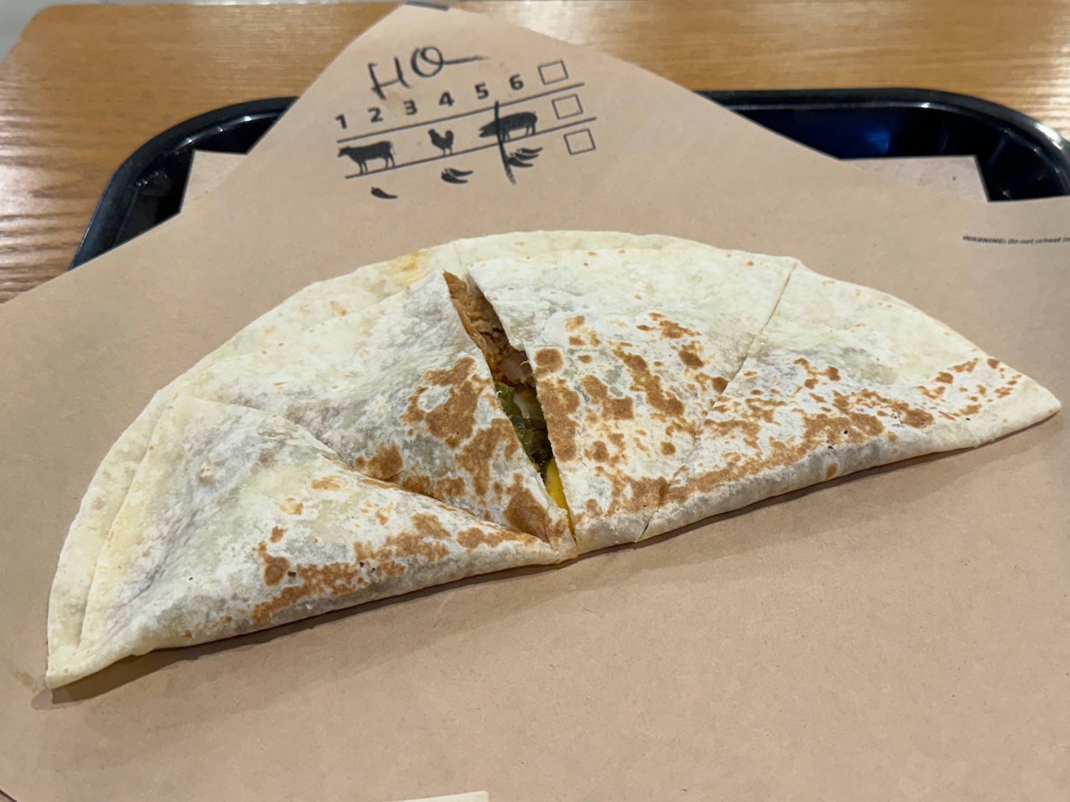 a quesadilla on a tray