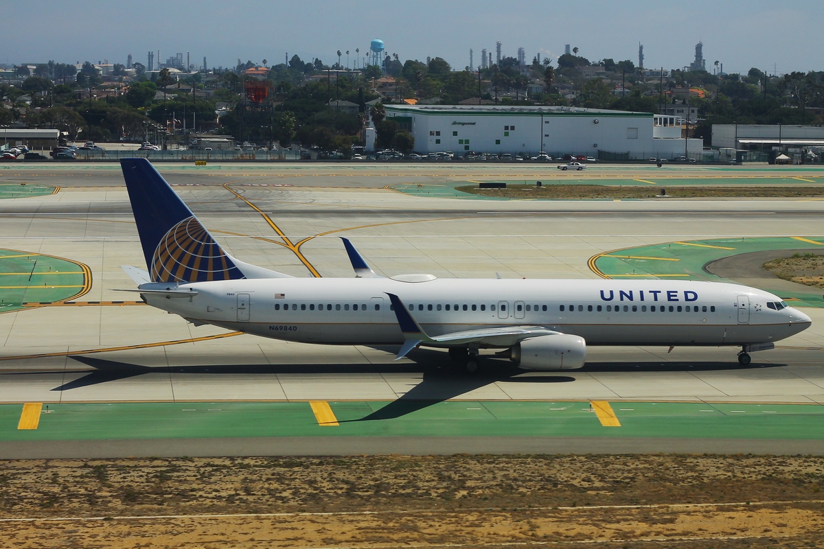 a white airplane on a runway