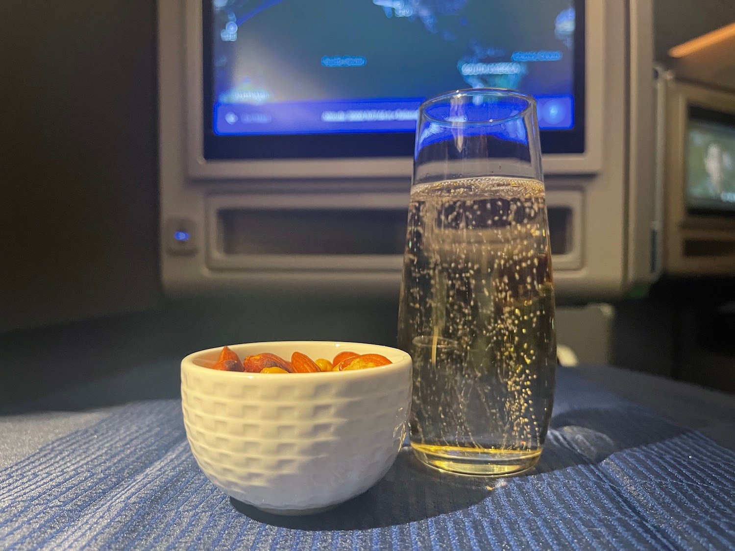 a bowl of fruit and a glass of liquid