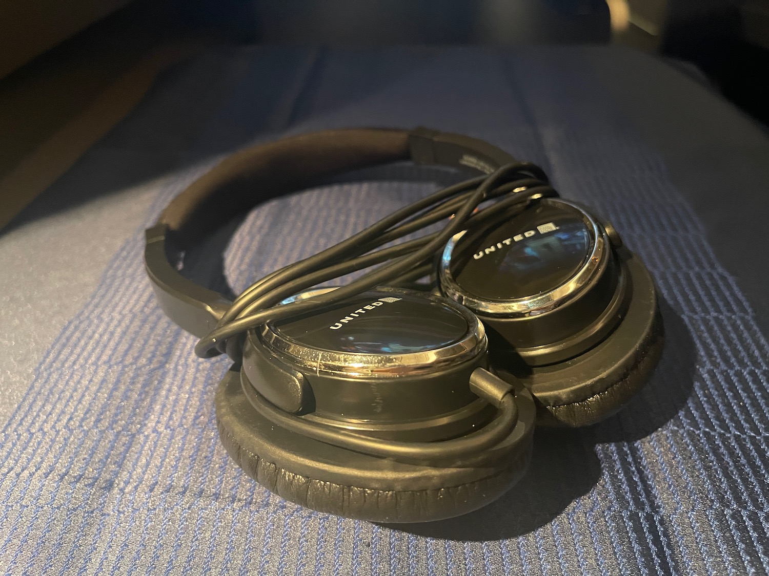 a pair of headphones on a blue surface