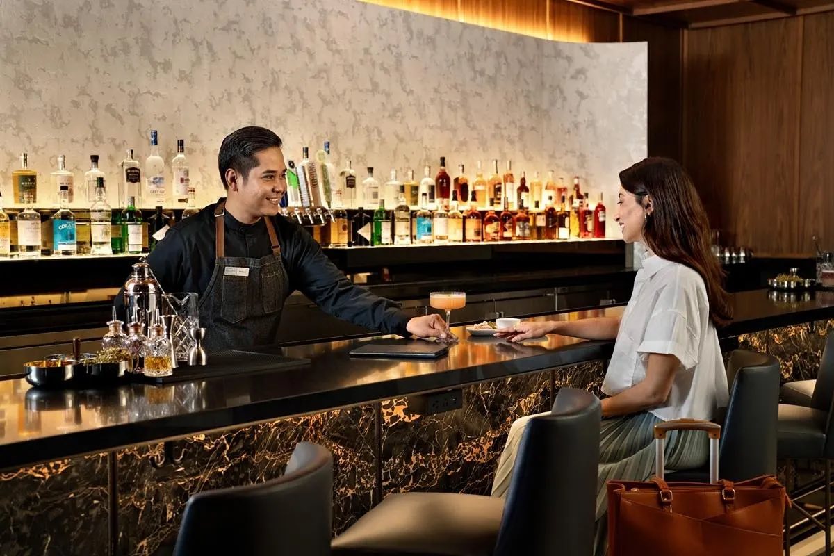 a man and woman at a bar