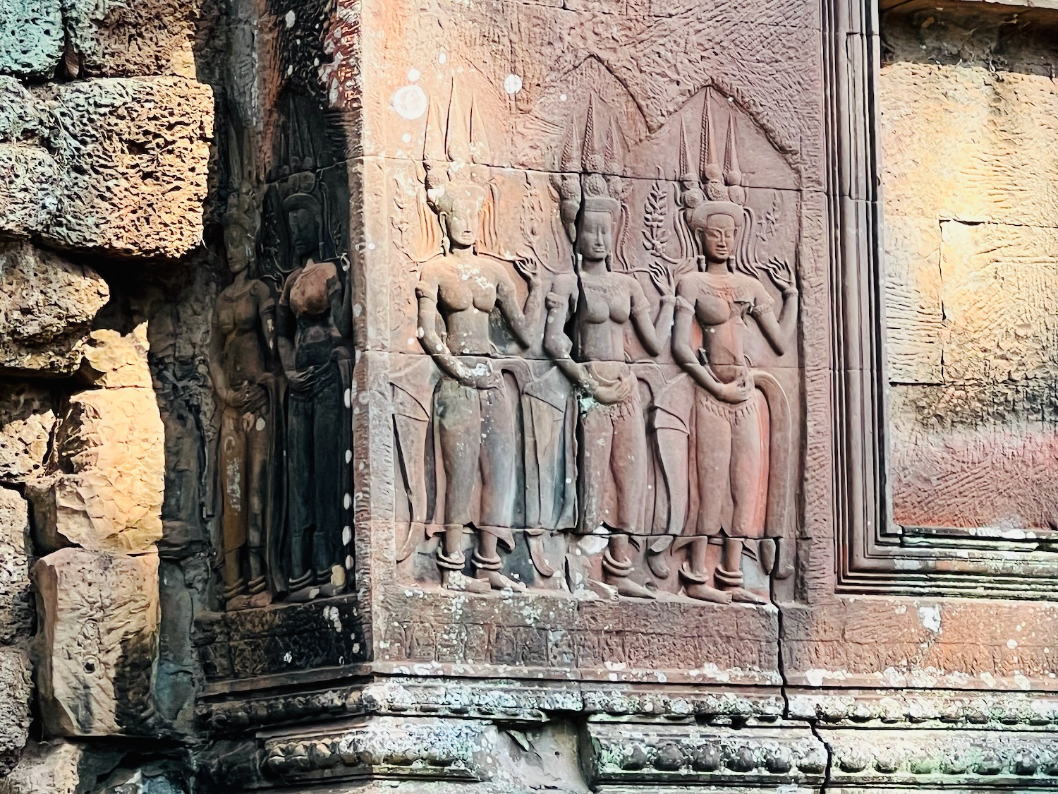 a stone carving of a group of women