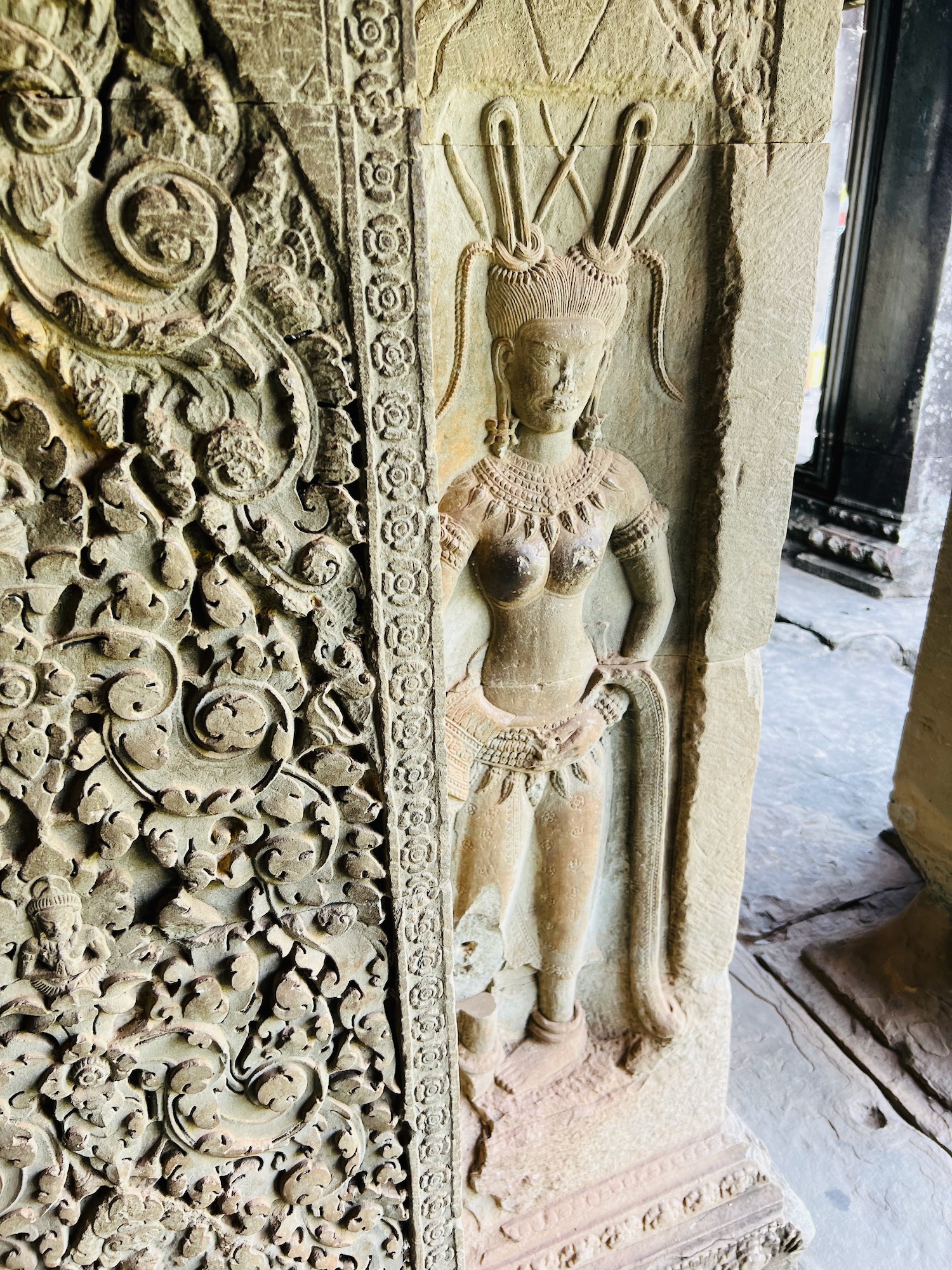 a stone carving of a woman