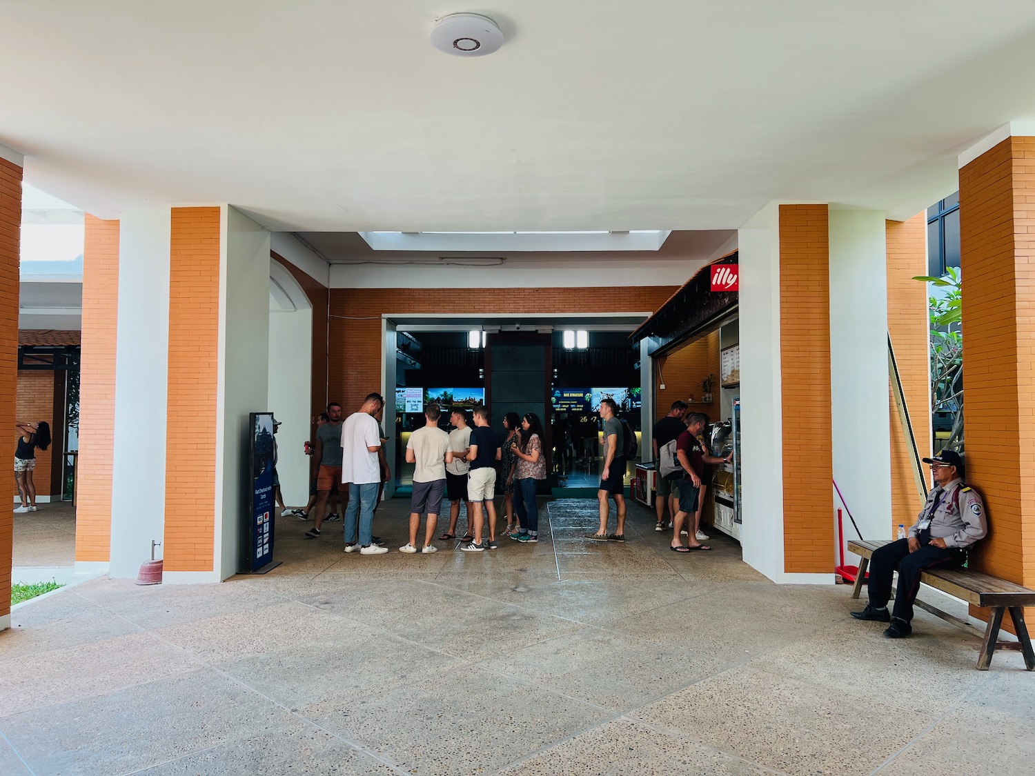 a group of people standing in a hallway