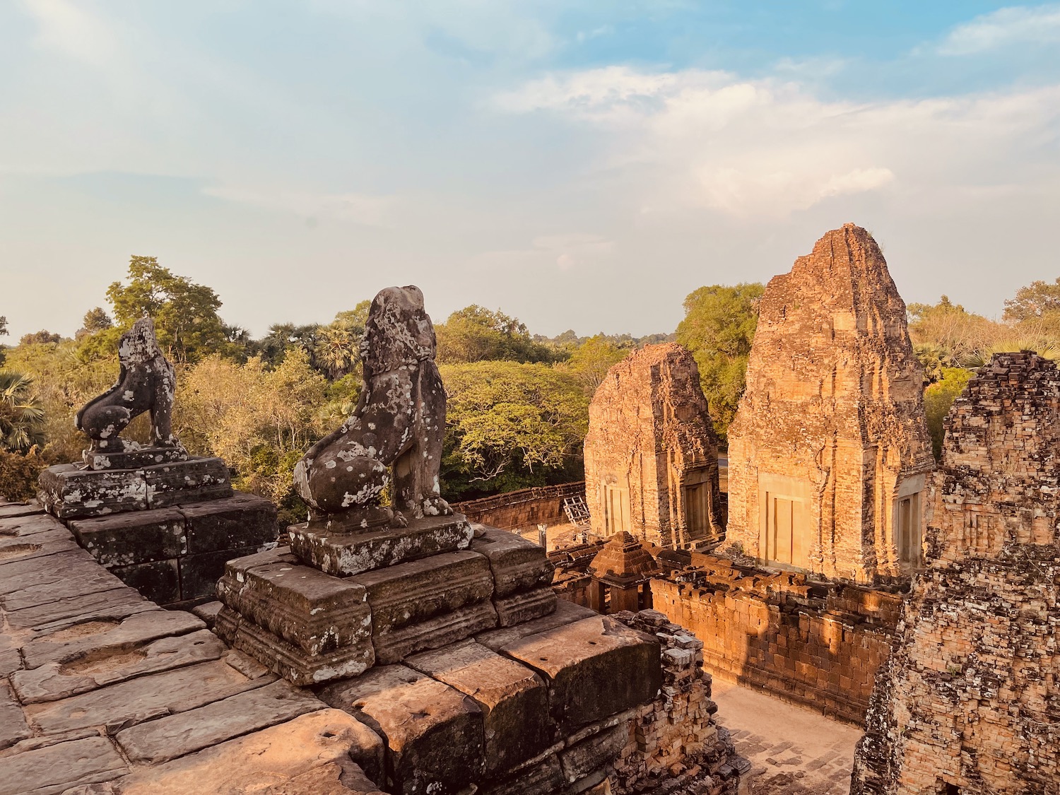 stone ruins with lions and trees