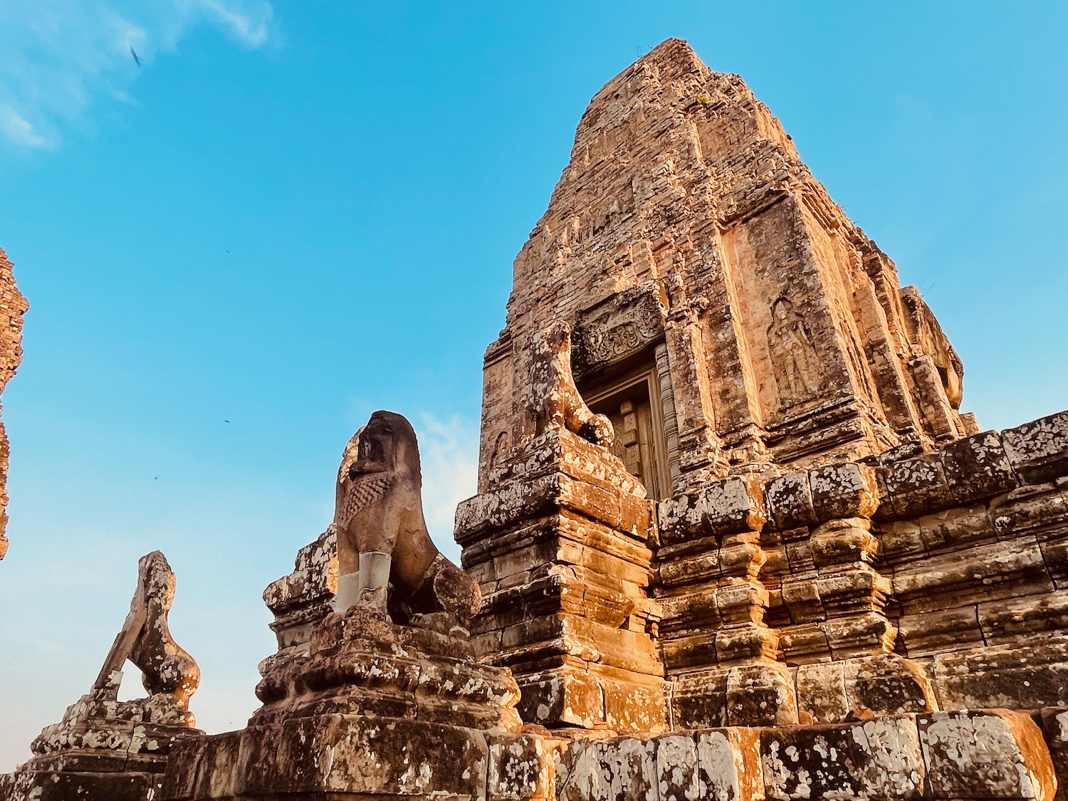 a stone building with a lion statue