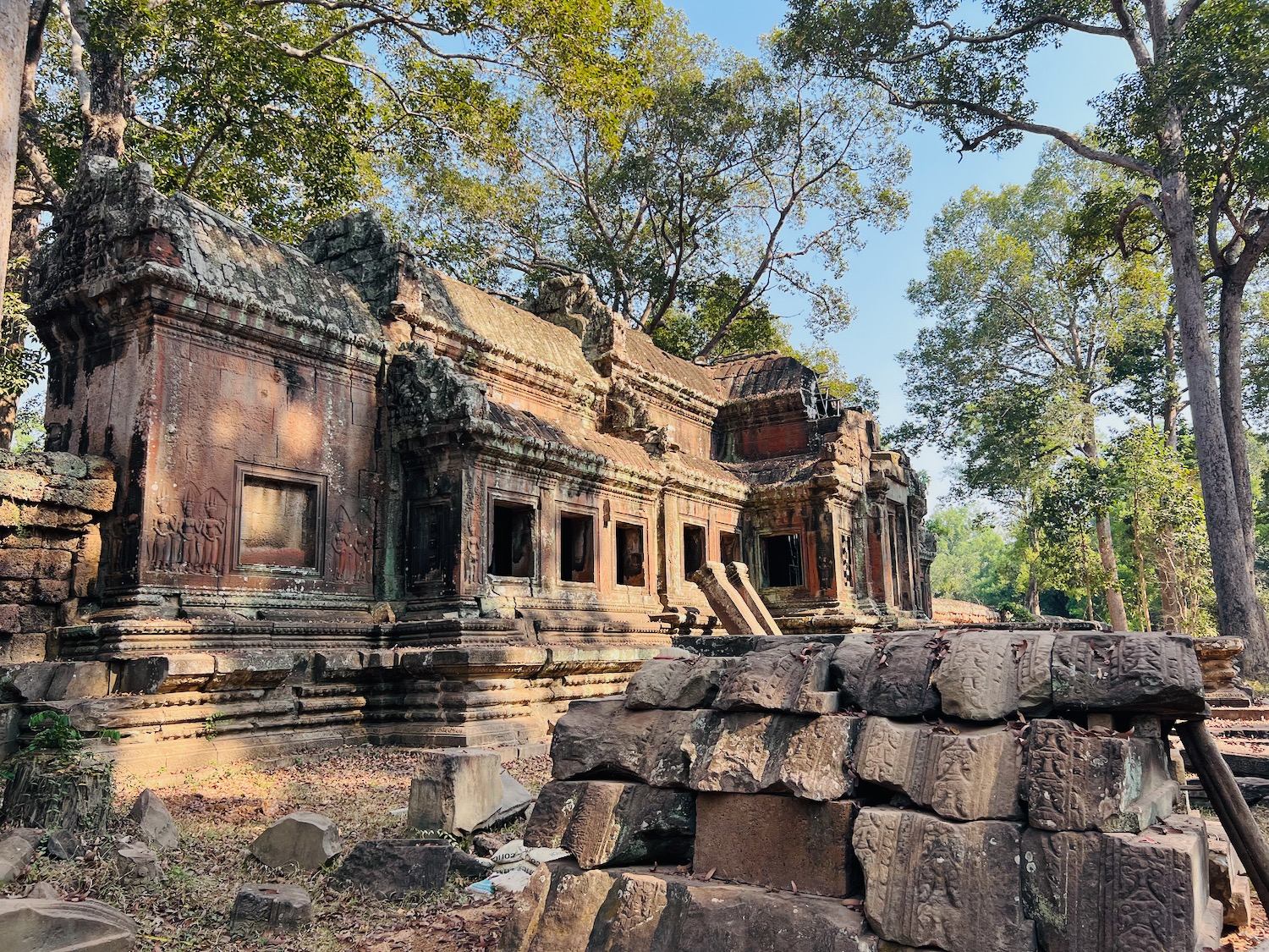 a stone building with trees around it