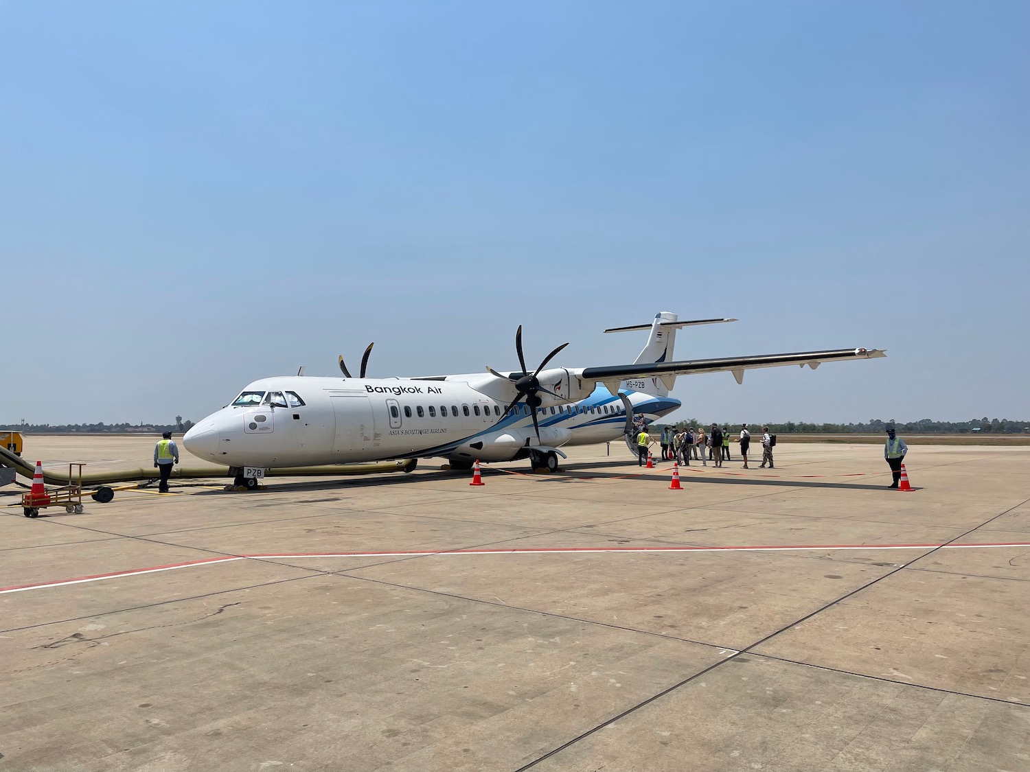 a white airplane on a runway