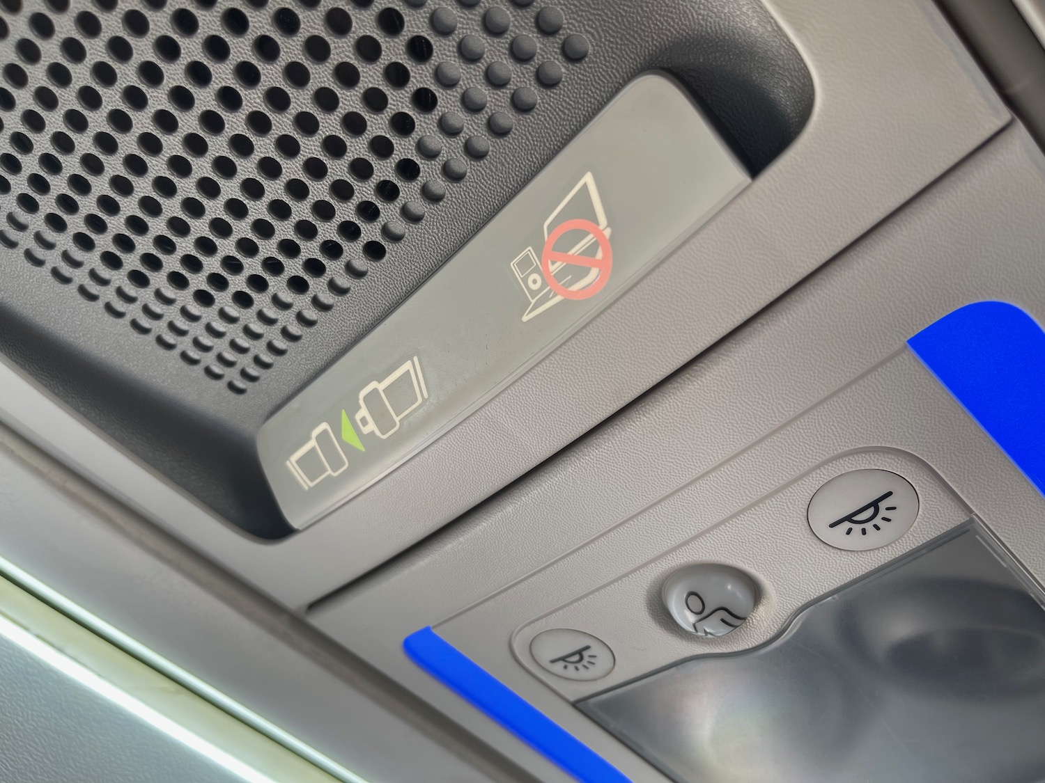 a close up of a seat belt and seat lights