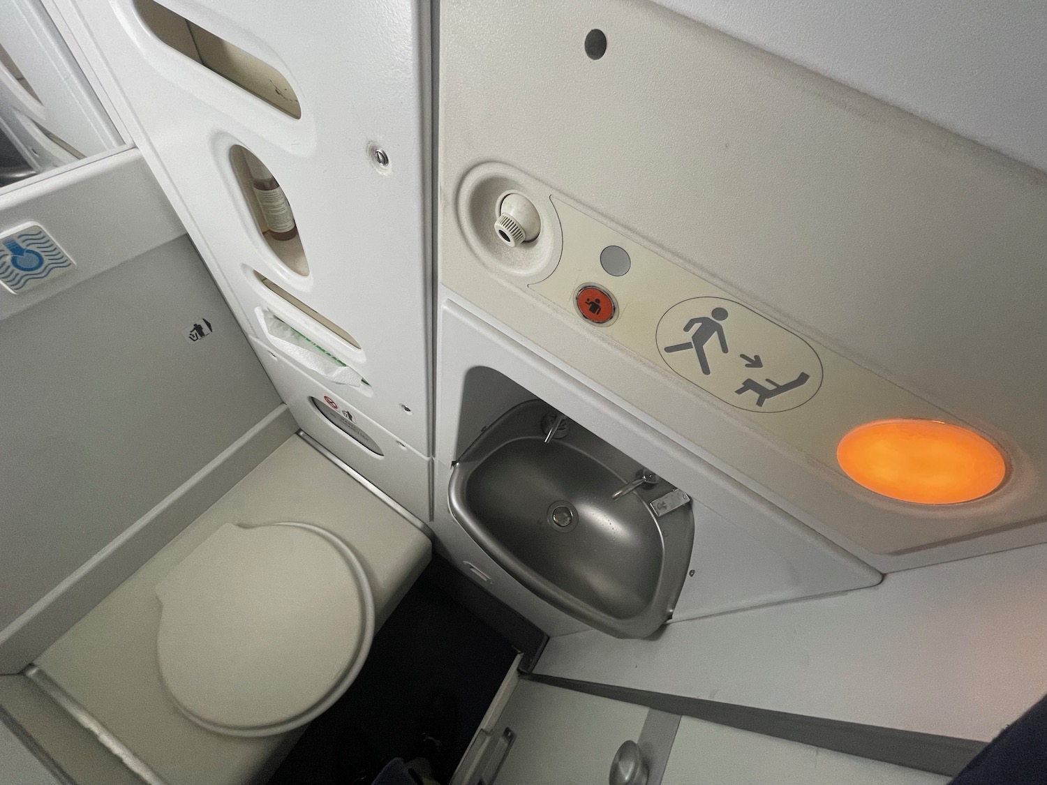 a toilet and sink in a plane