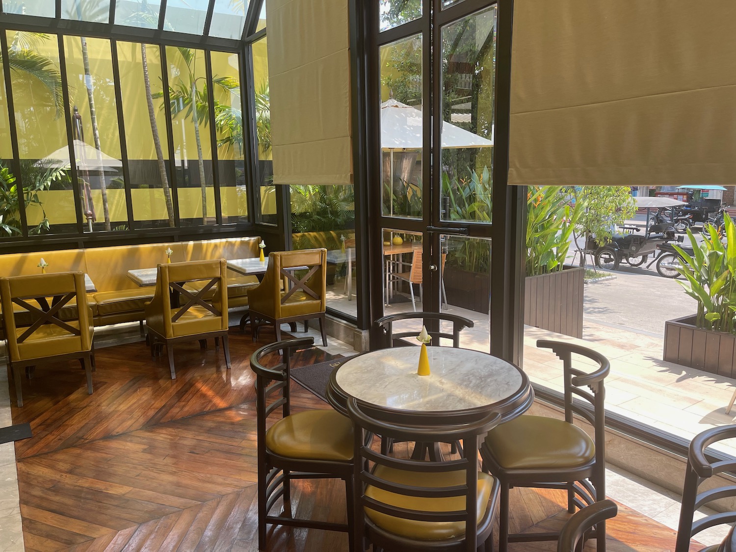 a table and chairs in a room with glass walls