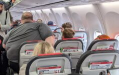 a group of people sitting in an airplane