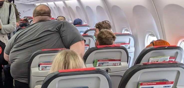 a group of people sitting in an airplane