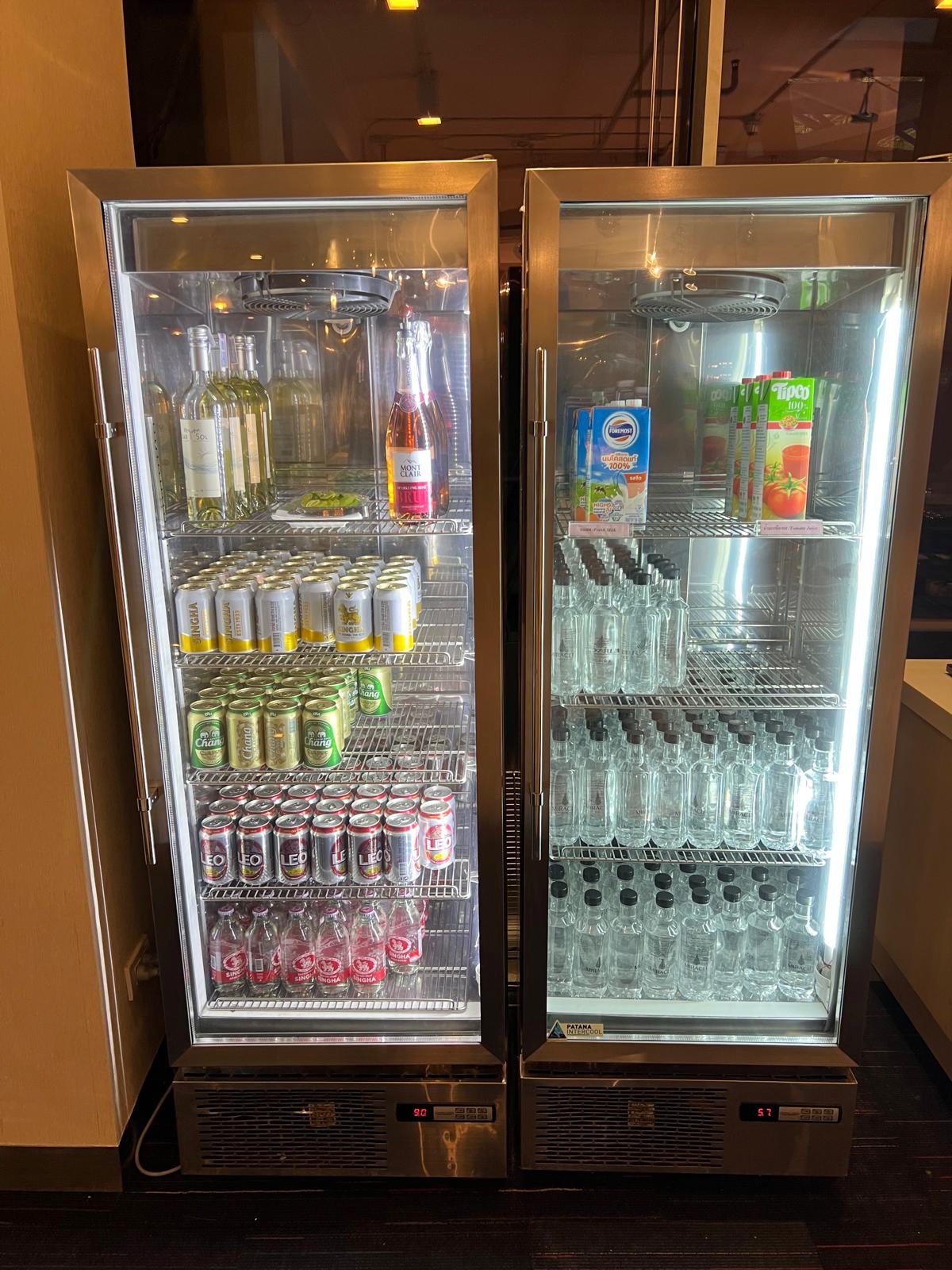 a refrigerator with drinks and cans