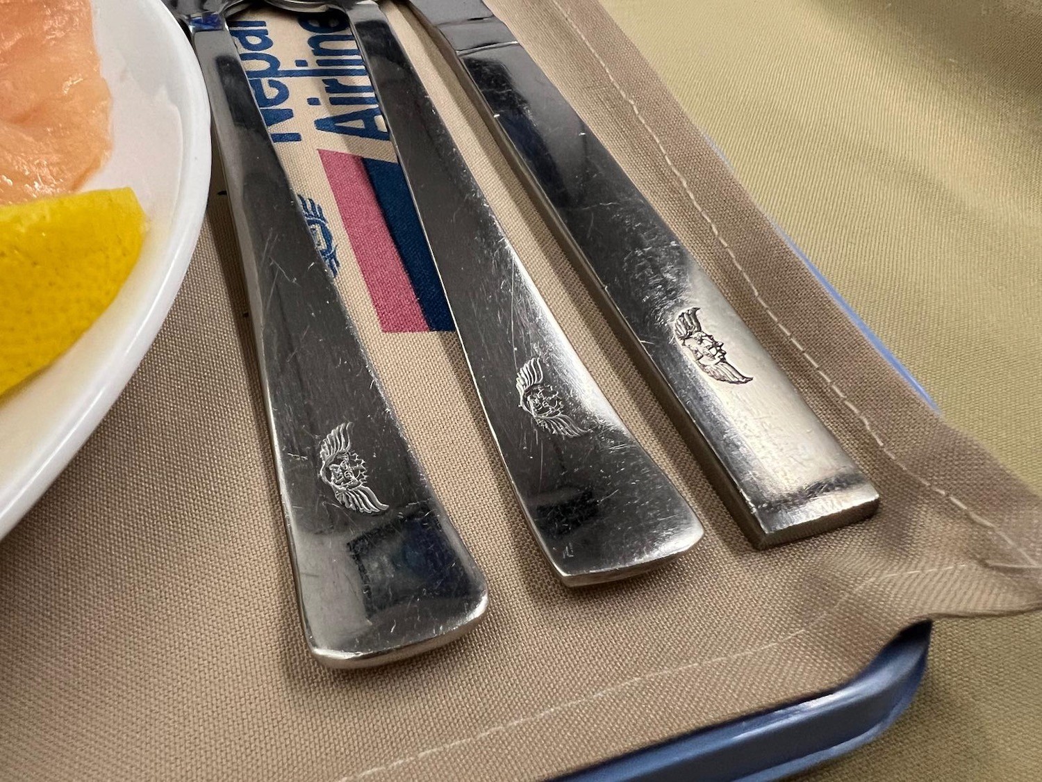 a group of silverware on a tray