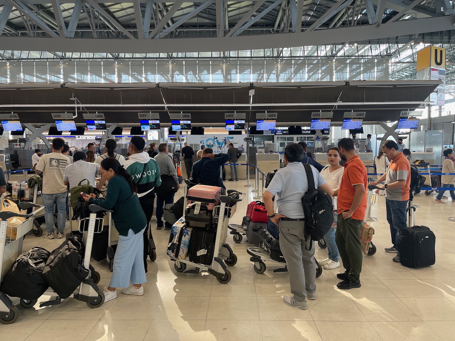 a group of people standing in a terminal