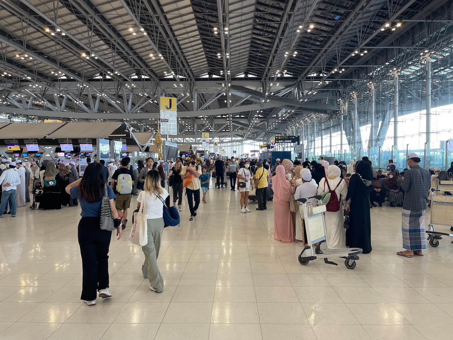 a group of people in a large airport