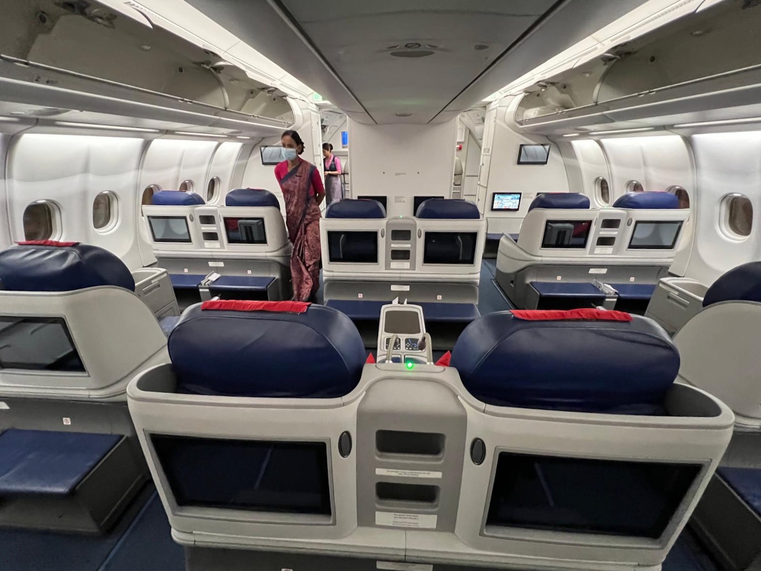 a woman standing in an airplane